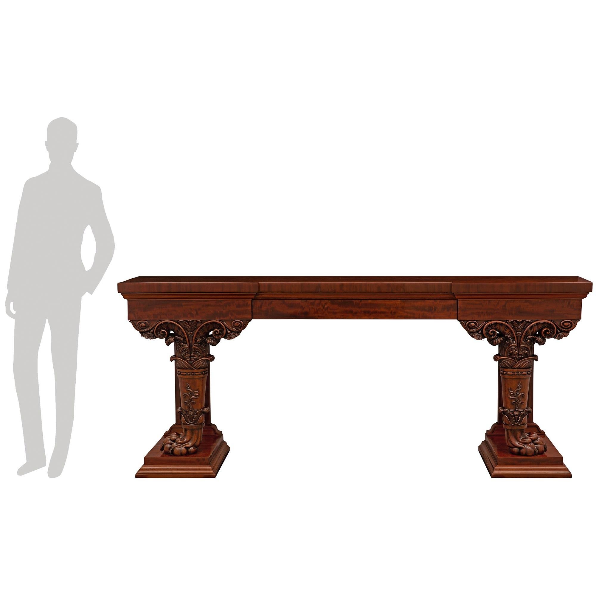 An important and most impressive Italian mid 19th century Moucheté mahogany Regency st. console, possibly by renowned woodworker Peters. The large scale freestanding console is raised by mottled supports below impressive circular tapered legs with