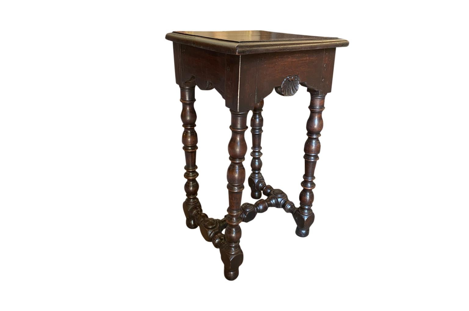 A very handsome mid-19th century Louis XIII style Selette - Side table from Northern Italy in beautiful walnut. Beautiful carved shell motif and nicely turned legs. Great patina - warm and luminous.