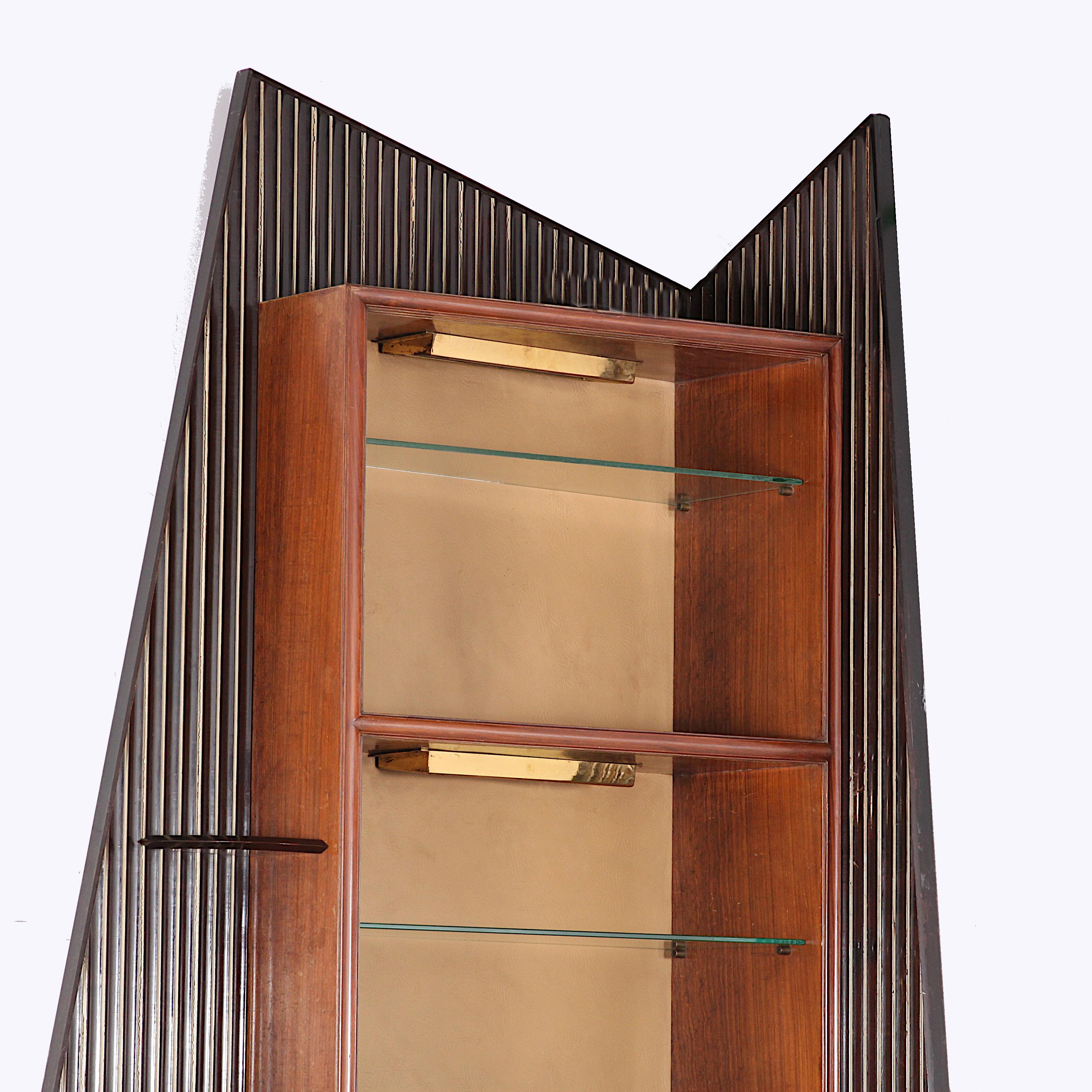 Italian mid-20th century curved bar & matching wall-mounted corner shelf in glass and exotic wood attributed to Osvaldo Borsani. Sleek fluted surfaces and bold assymetrical shape to the corner shelf. Backing of 100% leather on shelving unit which