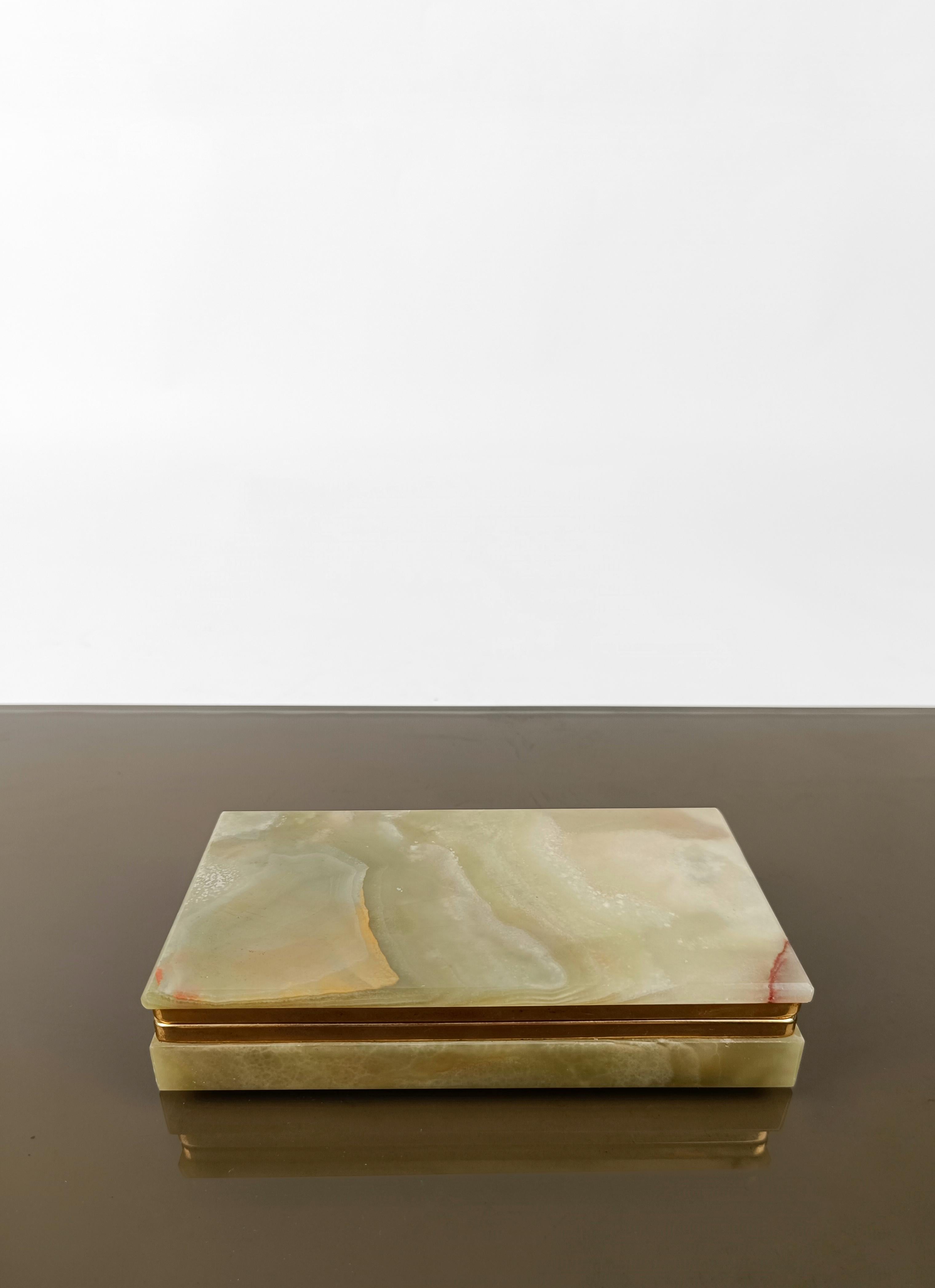 A box designed in shape and size to contain cigarettes but which I also find perfect for containing jewels, as precious as the green onyx marble of which it is made. 
Made in Italy between the 1950s and 1960s, this vintage rectangular box this
