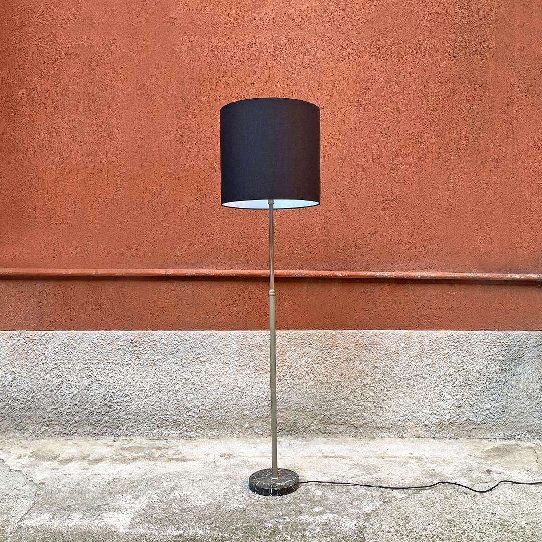 Italian mid-century adjustable floor lamp with Marquinia marble base, 1960s 
Adjustable floor lamp, with Marquinia marble base, telescopic structure in satin steel and cylindrical lampshade in black fabric, 1960s.

Excellent condition, new