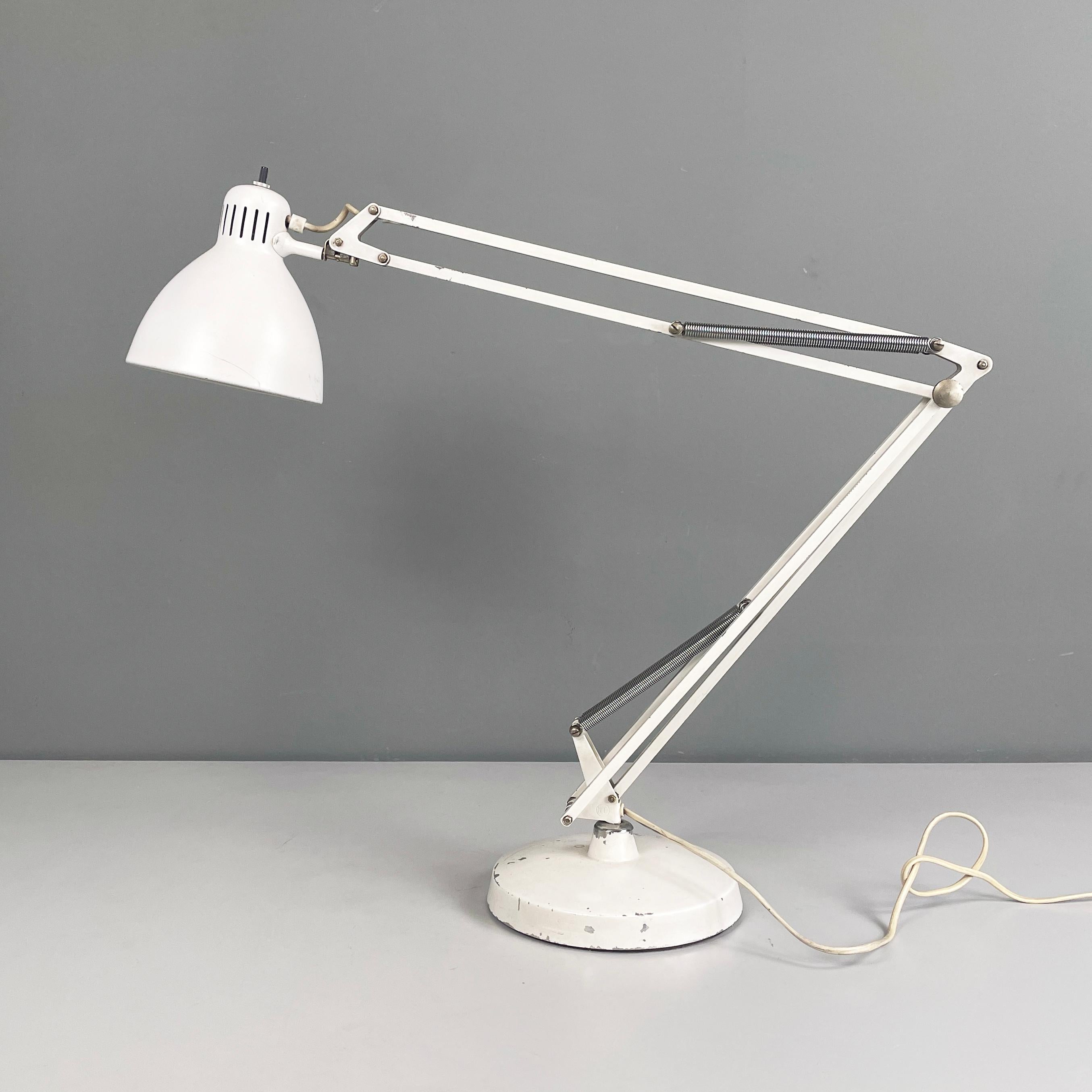 Italian mid-century modern Adjustable table lamp Naska Loris by Jac Jacobsen for Luxo, 1950s
Table lamp mod. Naska Loris with round base, entirely in white enamelled metal. The conical-shaped adjustable lampshade features a black switch. The
