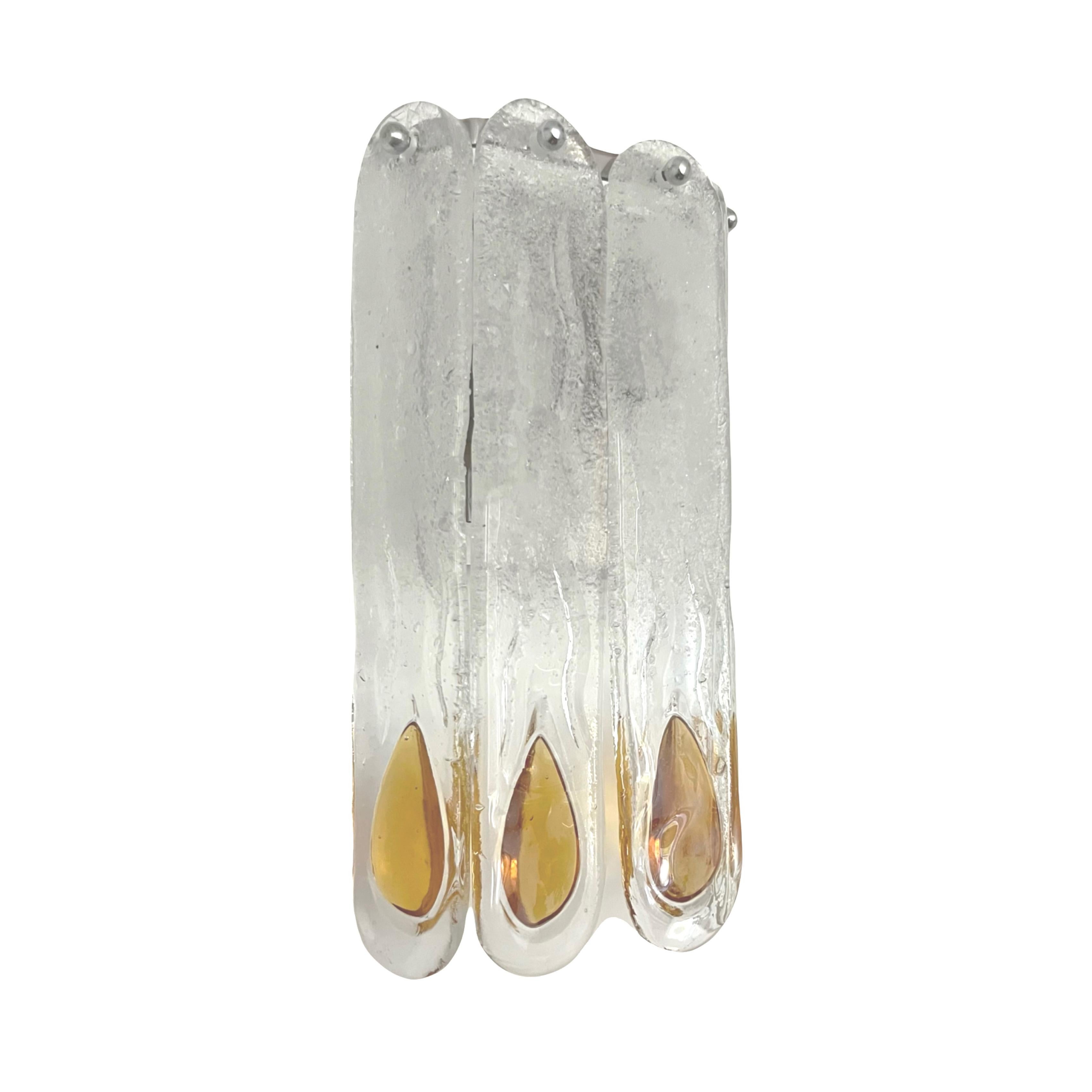 Pretty and beauty Italian Pair of Amber Clear Murano glass Wall Sconces. These fixtures were designed and manufactured during the 1970s in Italy by Mazzega.
Mazzega lie in the noble Venetian glassworking tradition; the firm was founded Angelo