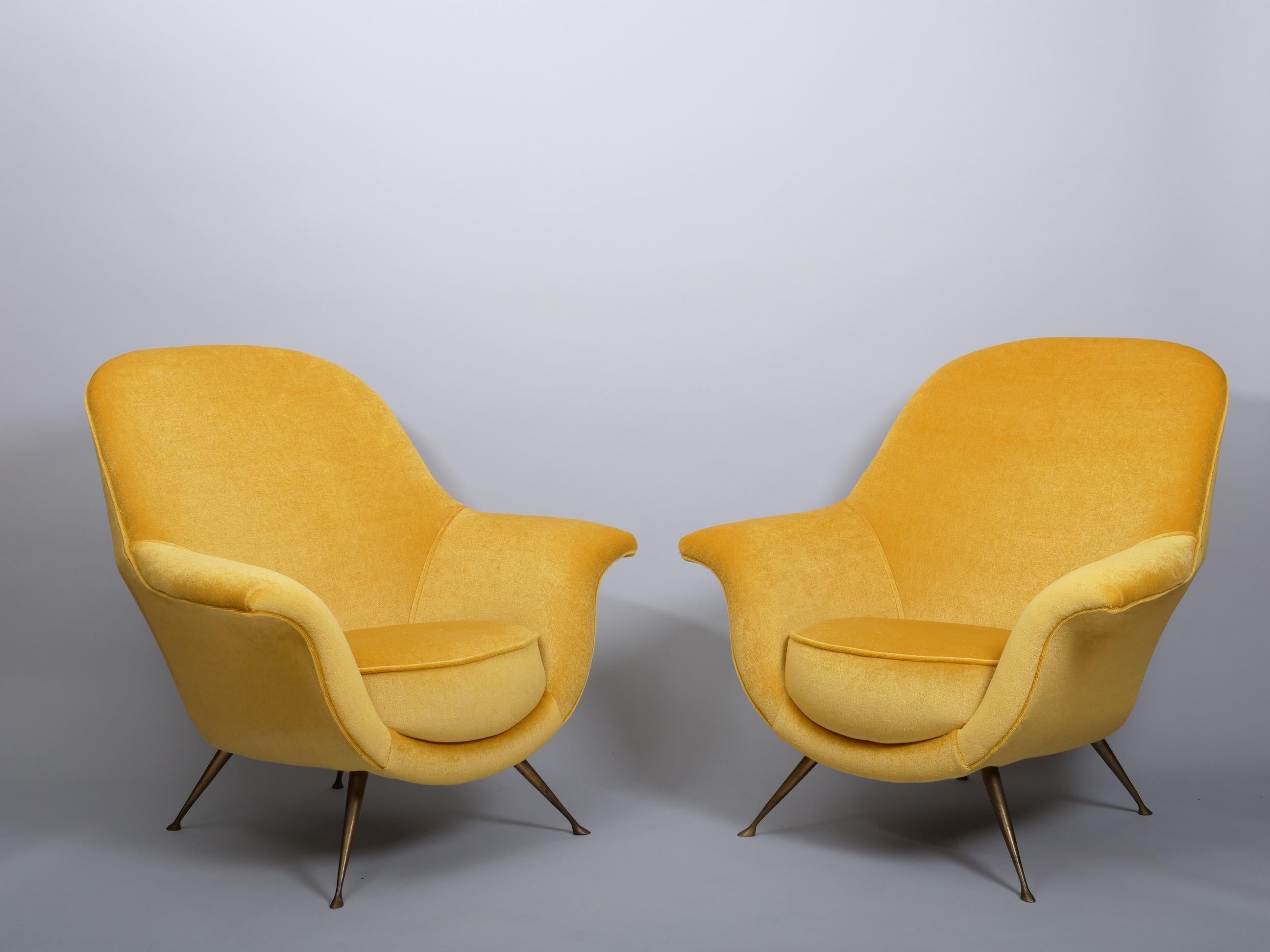 Elegant 1950s Italian midcentury armchairs.

Re upholstered in a gold mohair and silk velvet

Brass legs with patina