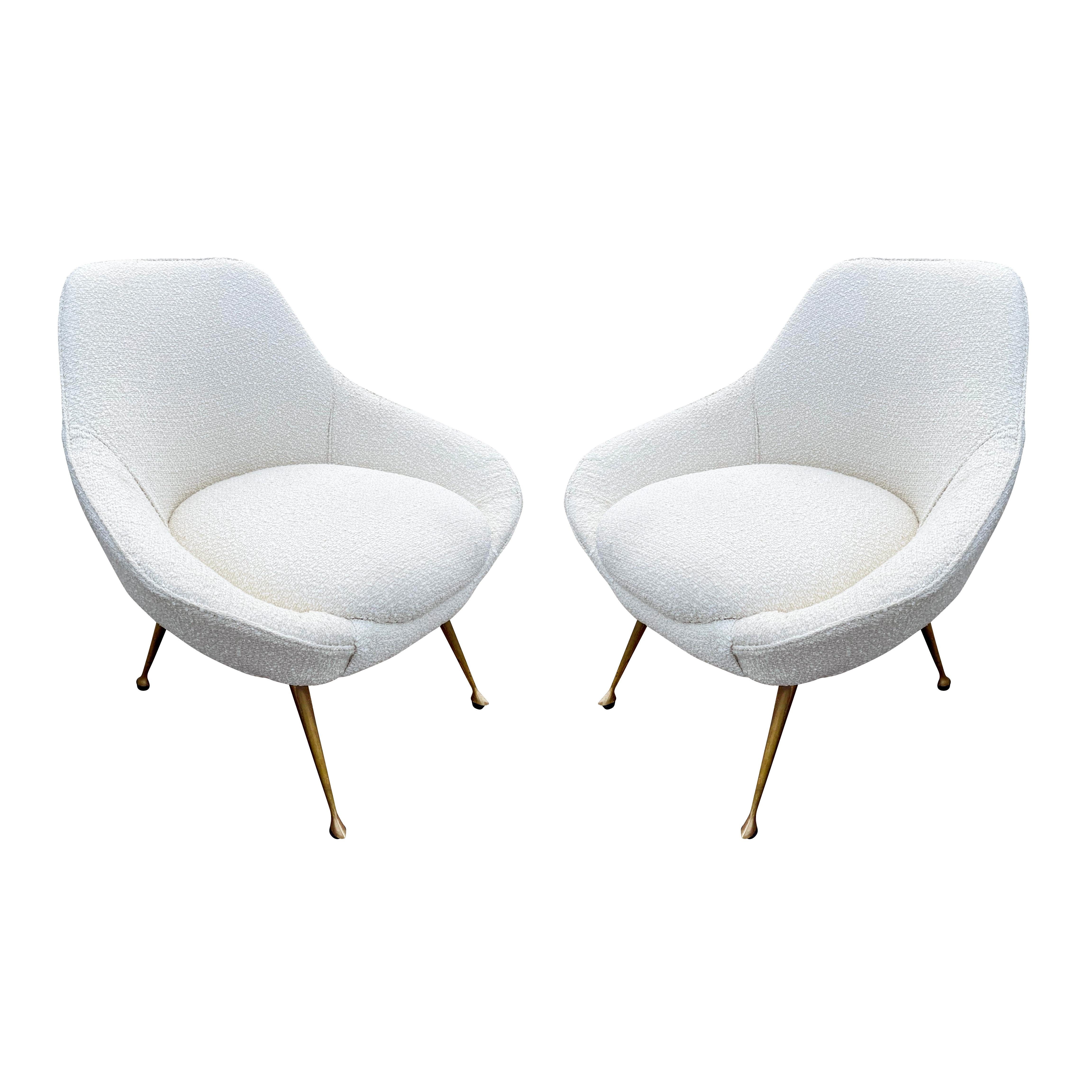 Italian midcentury armchairs with brass legs.
$6,500.00
Italian midcentury armchairs with a wide seat and tapering brass legs. Recovered in a white boucle fabric. Price for the pair-sold individually on request.

Condition: minor wear consistent