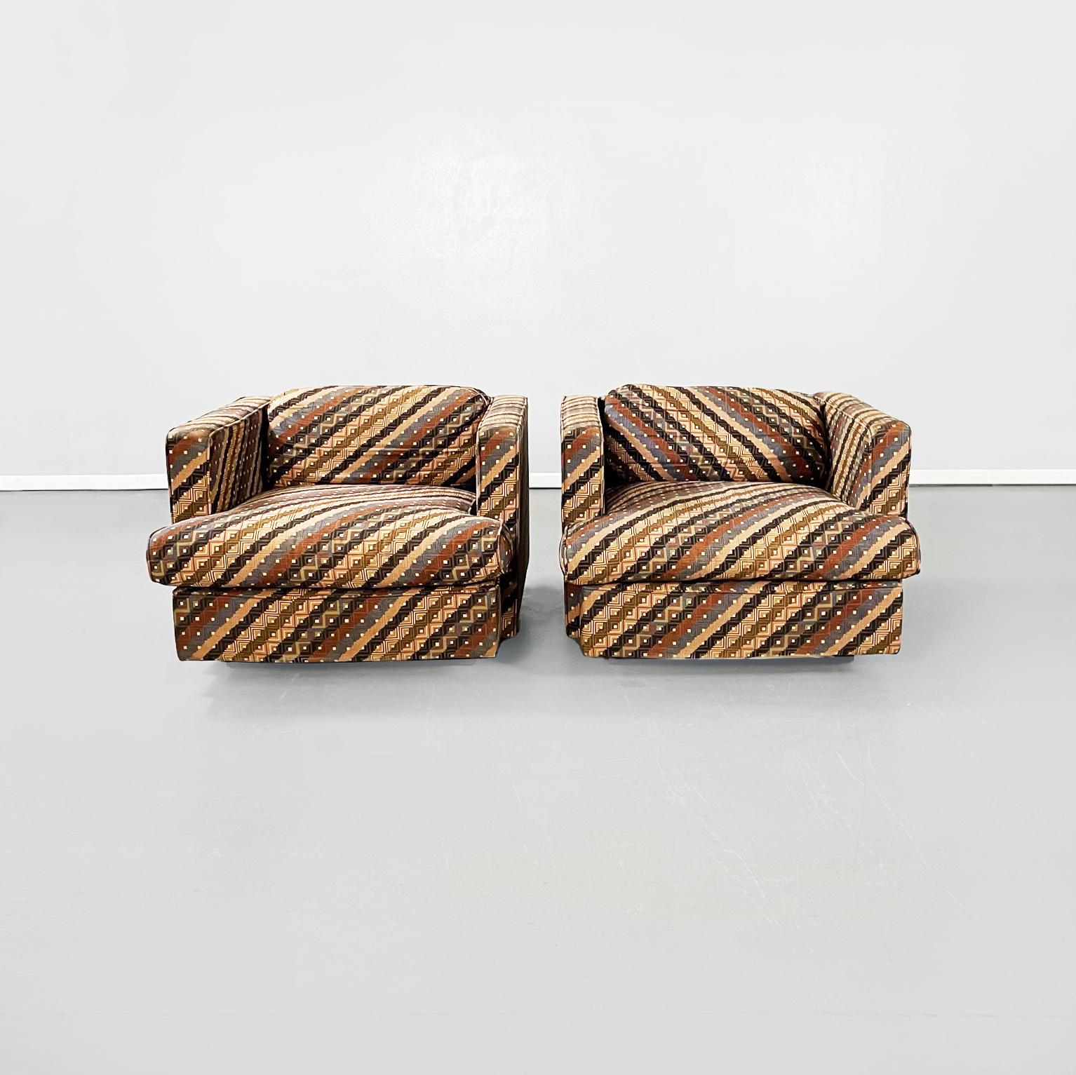 Italian mid-century armchairs with Missoni fabric by Saporiti Italia, 1980s
Pair of armchairs are upholstered and covered in Missoni's fabric with colorful stripe and square patterns. The two armchairs have a square seat that widens on the edge, a