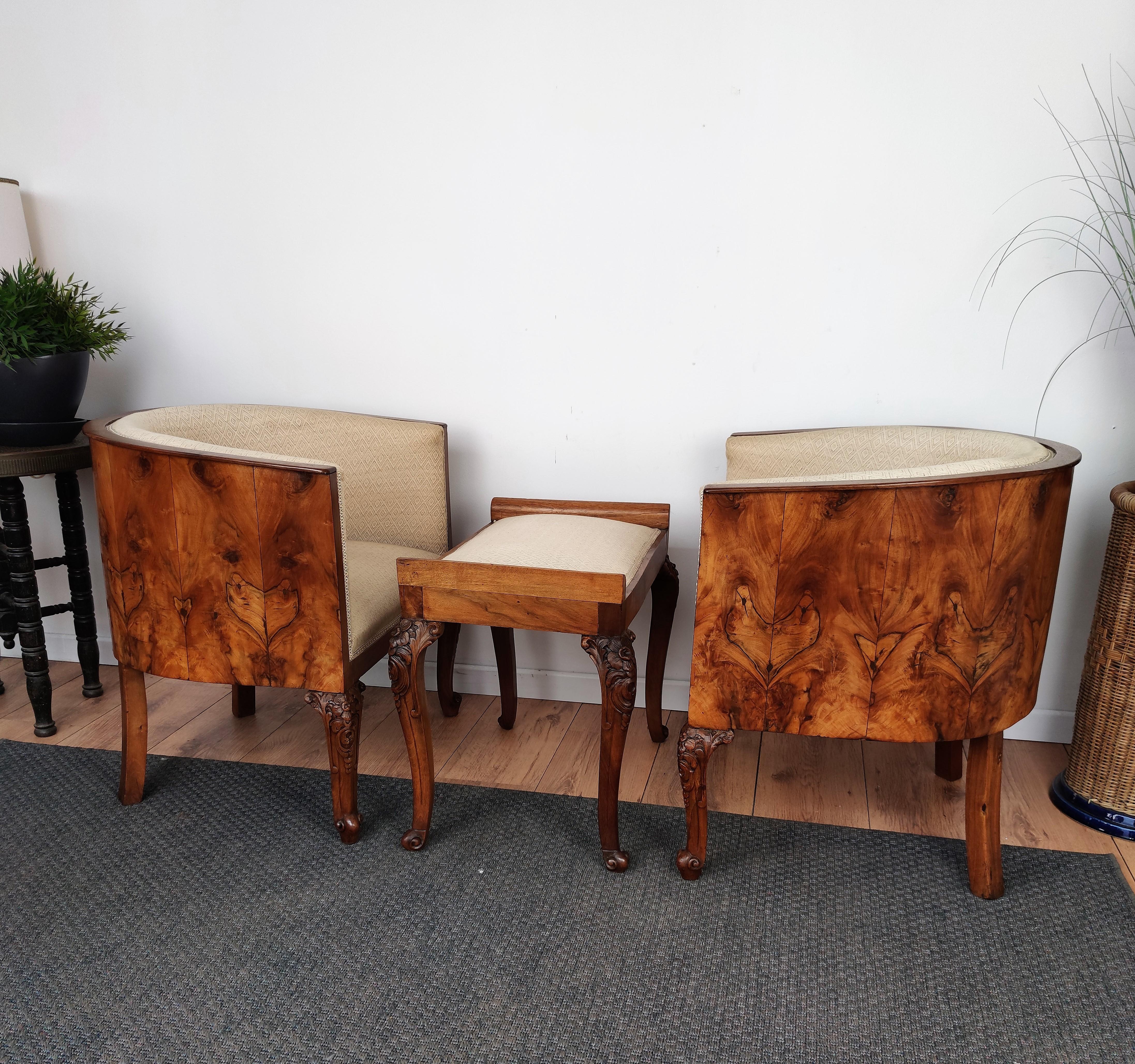 Very elegant and refined Italian 1940s midcentury Art Deco armchairs and stool with beautiful veneer burl walnut briar wood all around and great decorated legs. This set makes a great look in any style room, as a complementary design and especially