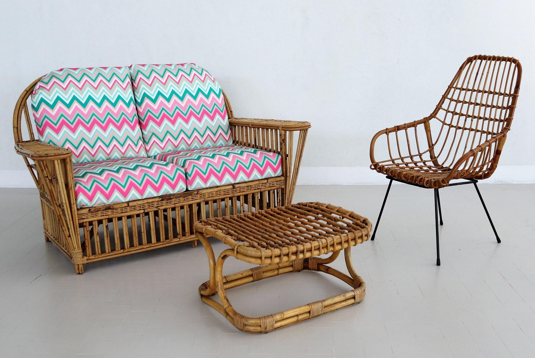 Gorgeous two-seater sofa made completely of bamboo and rattan in Italy, 1960s/1970s.
The sofa is in nearly excellent condition since it was placed inside the previous home.
The cushions have been upholstered with new outdoor fabric in colorful