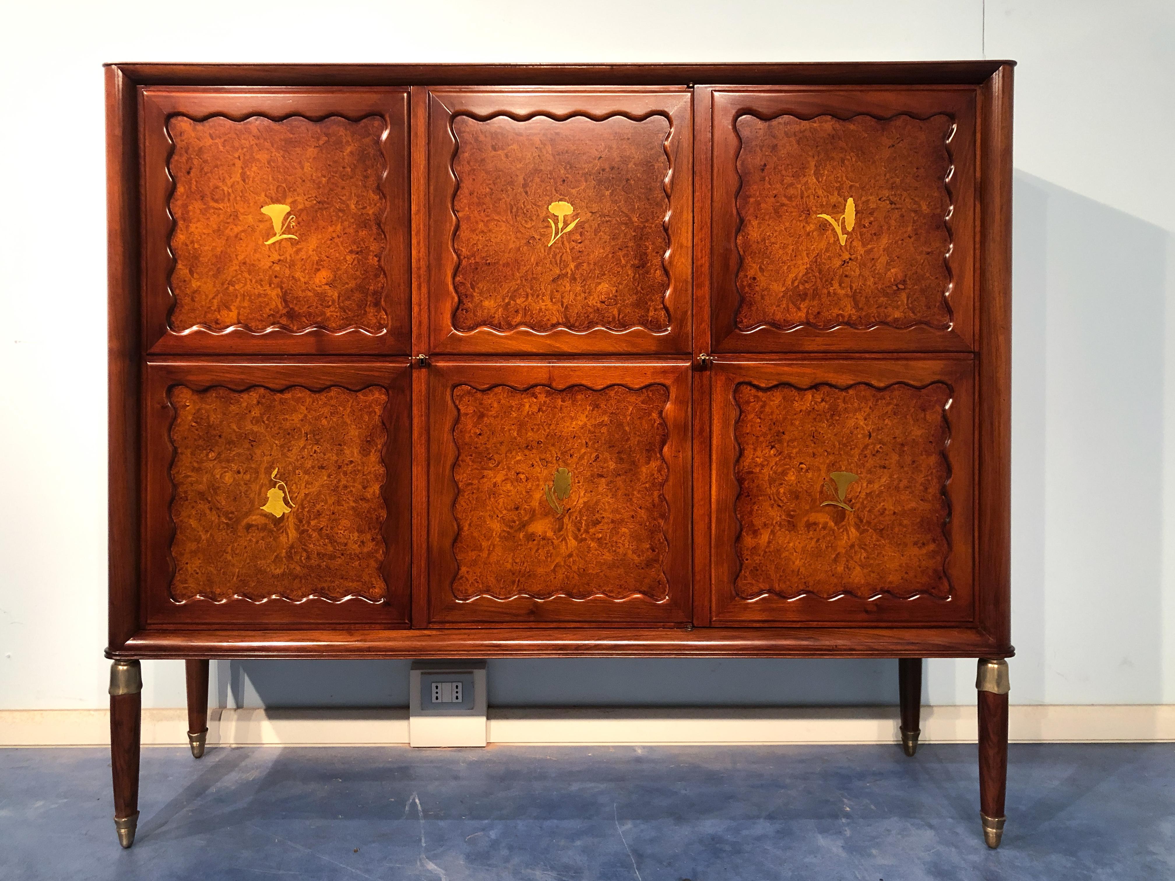 Beautiful Italian mid-century bar cabinet but could be used as high sideboard too, by Paolo Buffa, from the 1950s. The top is made of precious green Alps marble. The door's design is really refined, adorned with stylized brass flower motifs. Notable