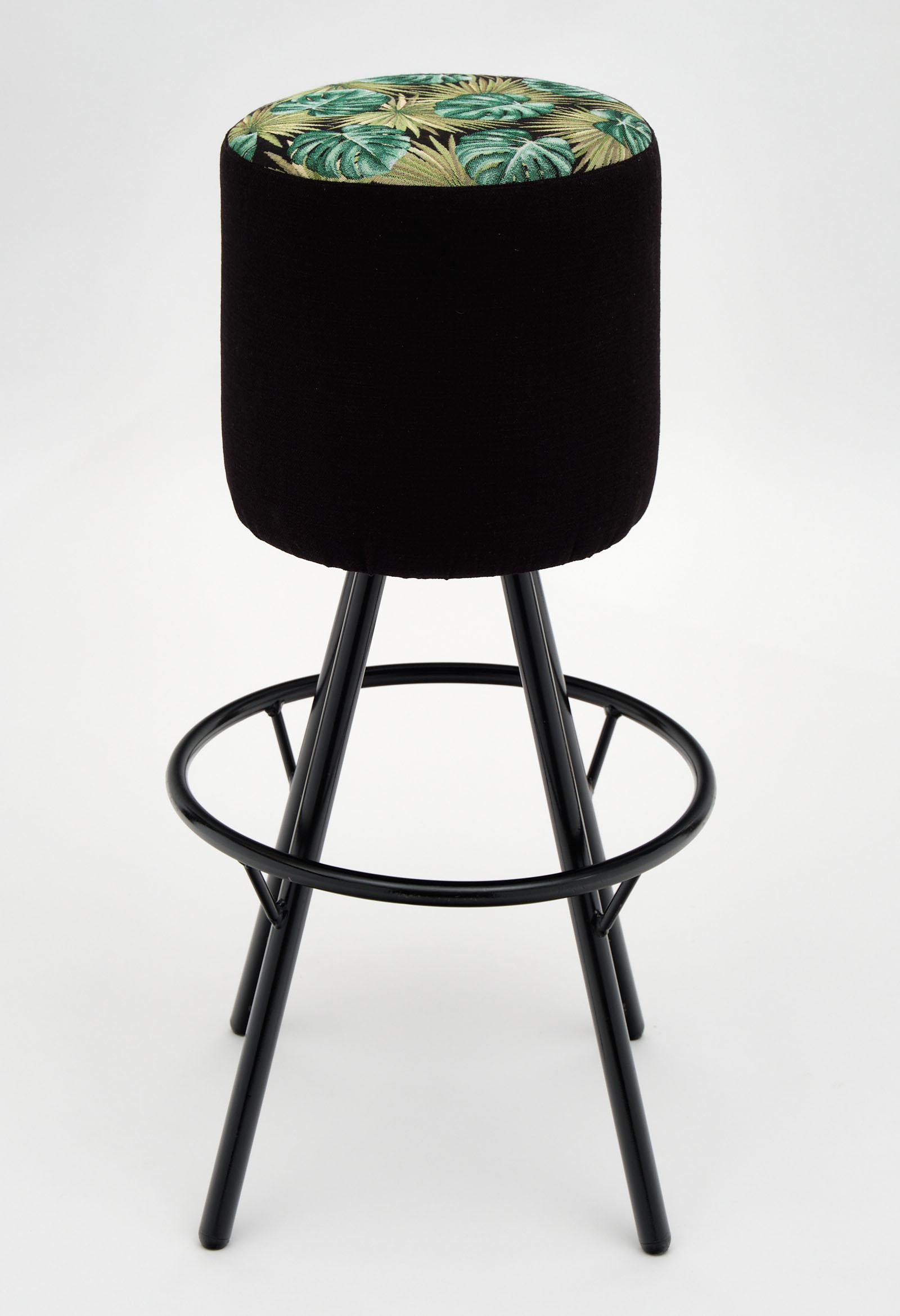 Set of four midcentury Italian bar stools with black lacquer vintage frames and comfortable, new exotic upholstery.