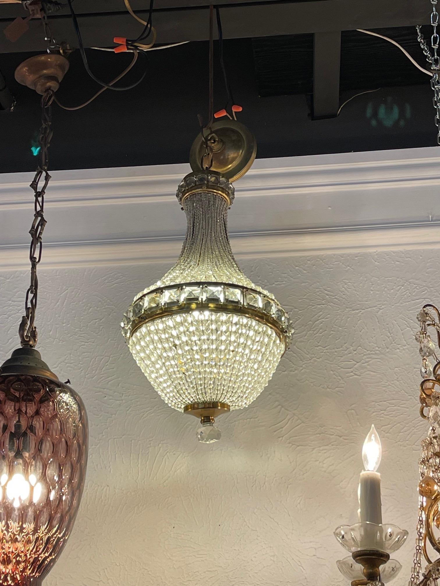 Very nice Italian mid-century beaded crystal and brass pendant light. A lovely fixture that creates a real touch of elegance!.