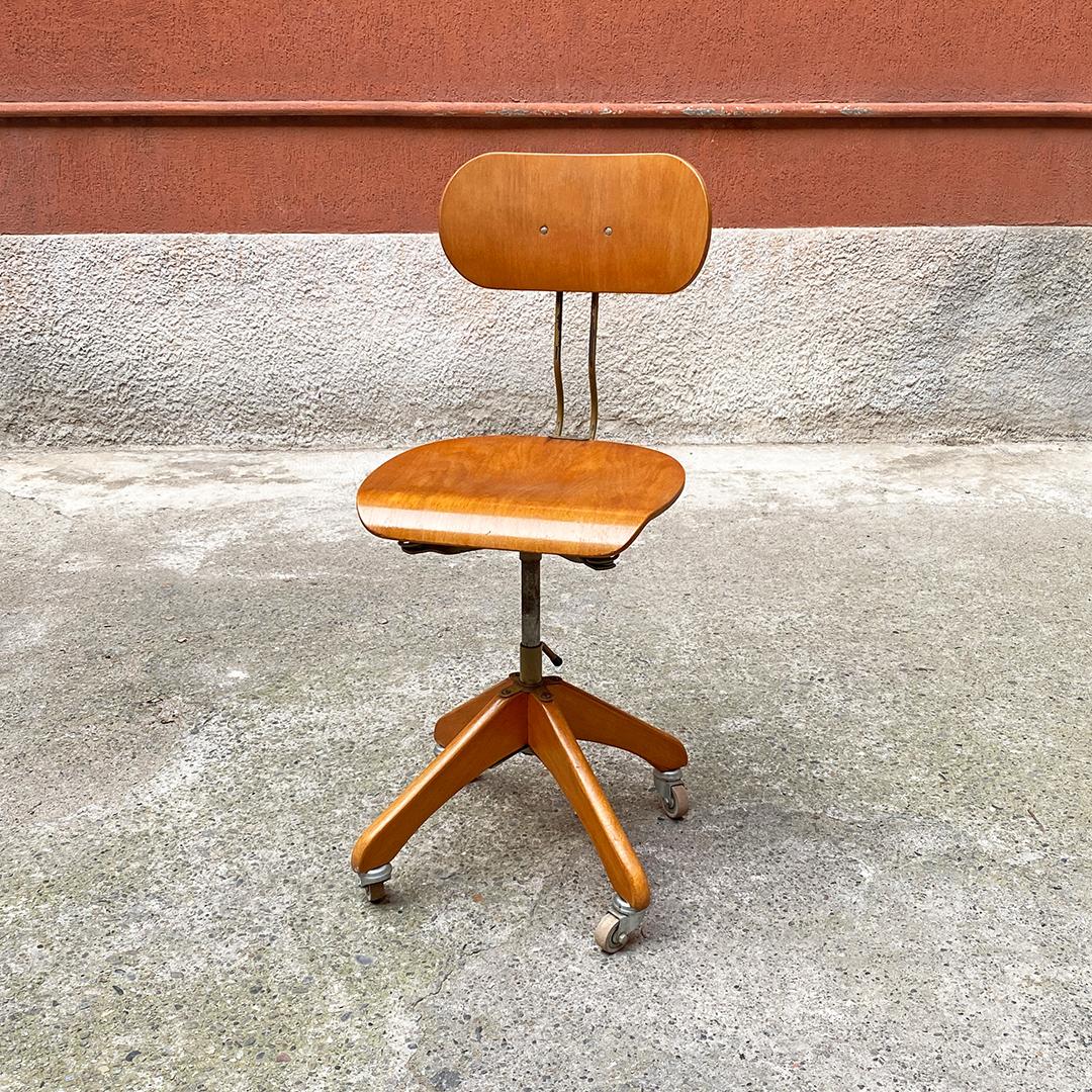 Beautiful and perfect for a desk,  deutsche Mid-Century Modern solid beech and metal industrial drafting machine stool, 1960s
Industrial drafting machine stool, with solid beech and metal frame, with springs under the seat and sliding rail to adjust