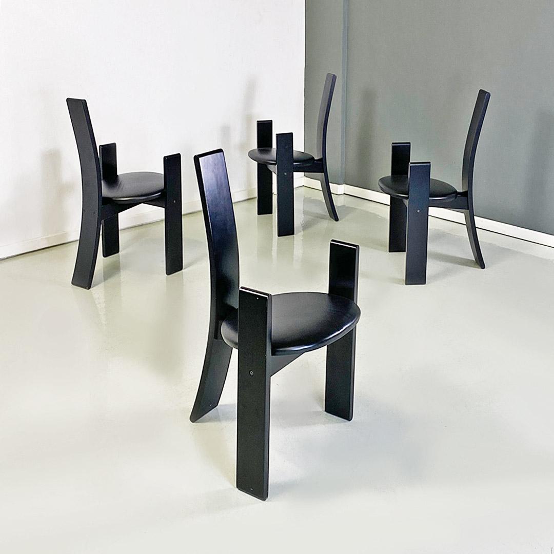 Italian mid century modern set of four black lacquered curved wood Golem chairs by Vico Magistretti for Carlo Poggi Pavia, 1968.
Golem model chairs with black lacquered wooden structure with three curved legs, of which the higher rear one becomes a