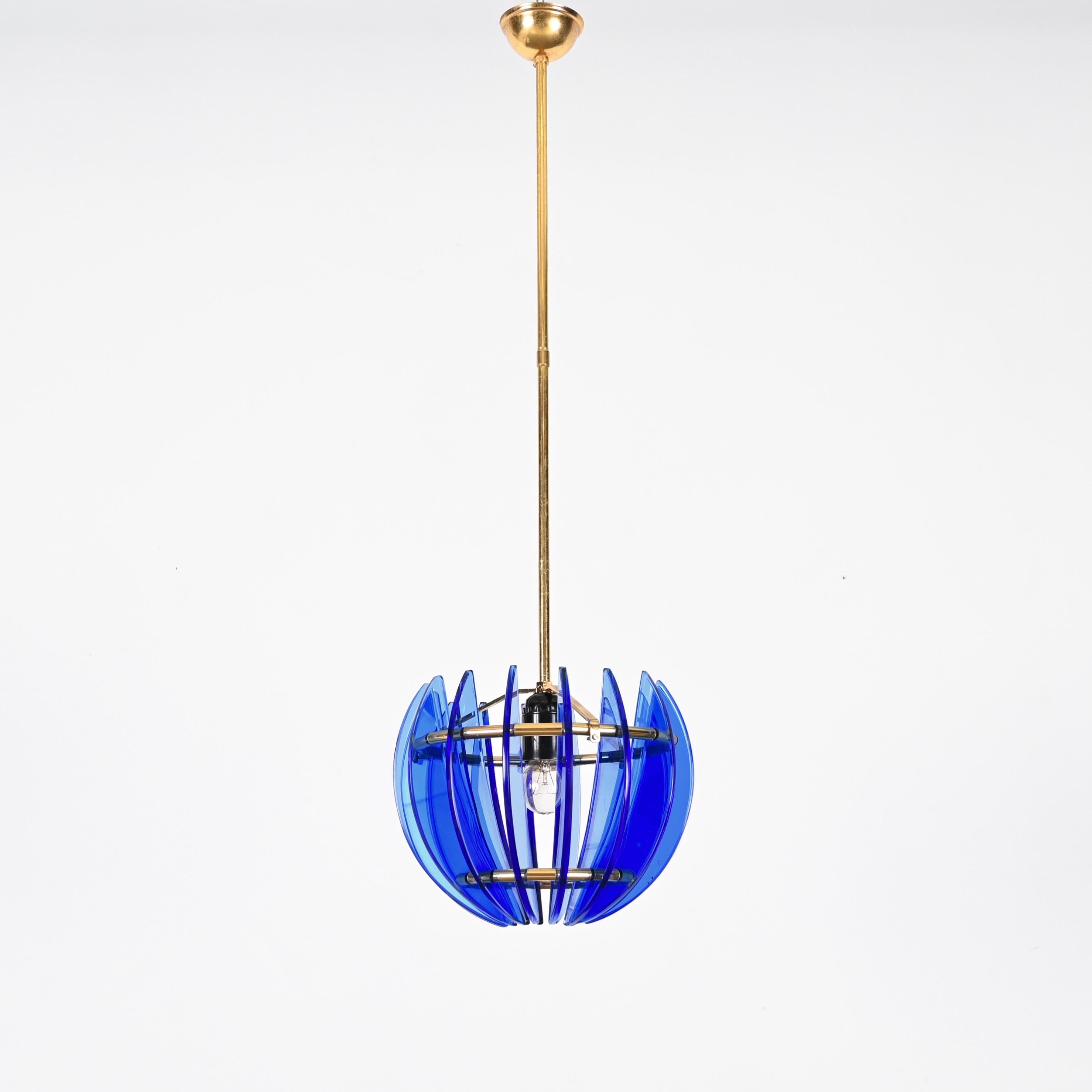 Mid-Century Italian pendant made in a stunning blue Murano artglass and solid brass. This incredibly charming pendant was produced by Galvorame  in Italy during the 1960s. 

This pendant consists of sixteen crescent-shaped murano glasses in a