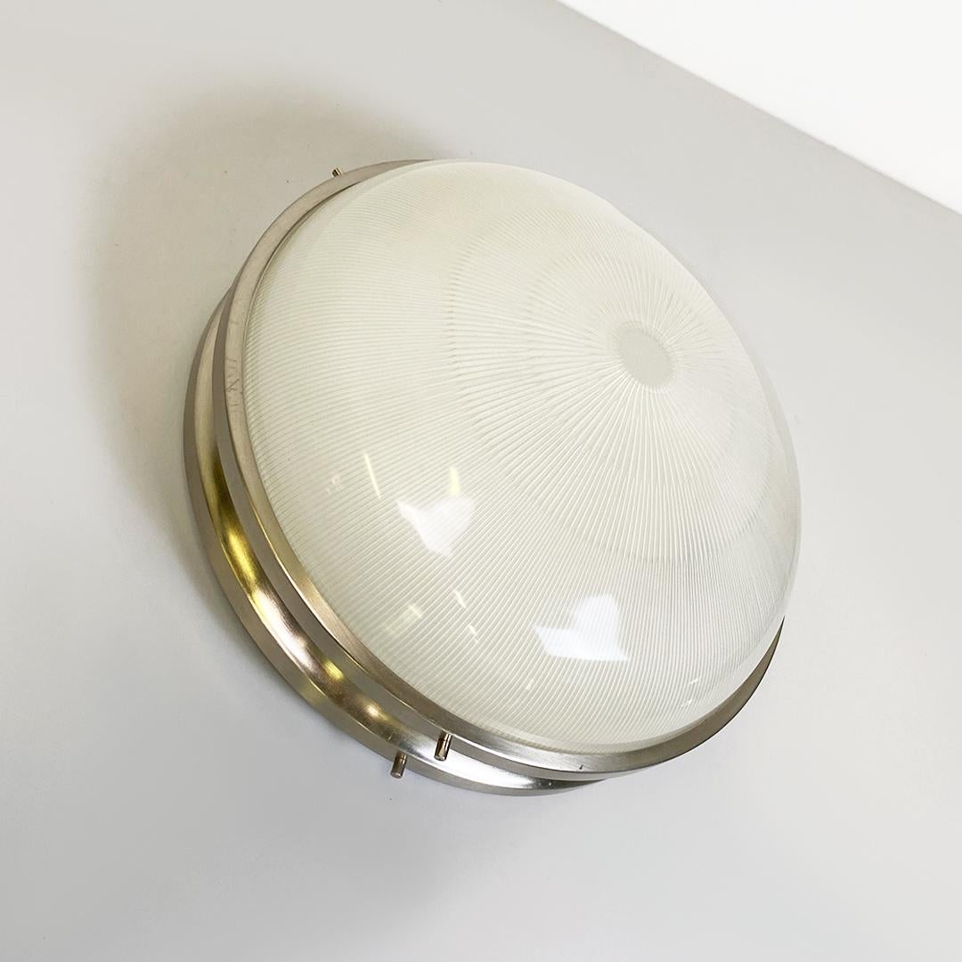 Italian mid century modern nickel-plated brass and glass Sigma lamp by Sergio Mazza for Artemide, 1960s.
Sigma model wall lamp with nickel-plated brass structure and glass diffuser. It can be used both as a wall and ceiling lamp, but with a small