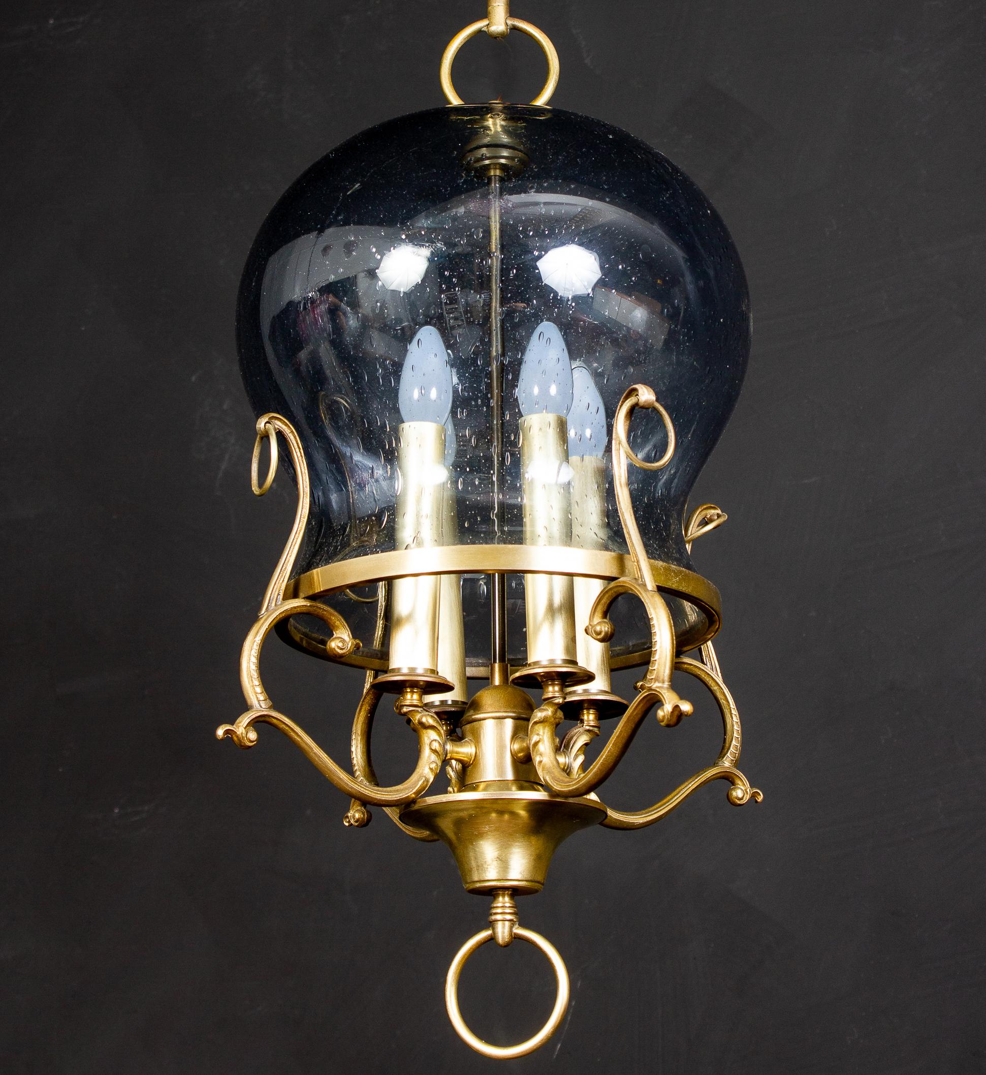Amazing Italian midcentury brass and light blue Murano glass lantern or pendant.
Four E 14 light bulbs. We can wire for your country standards.