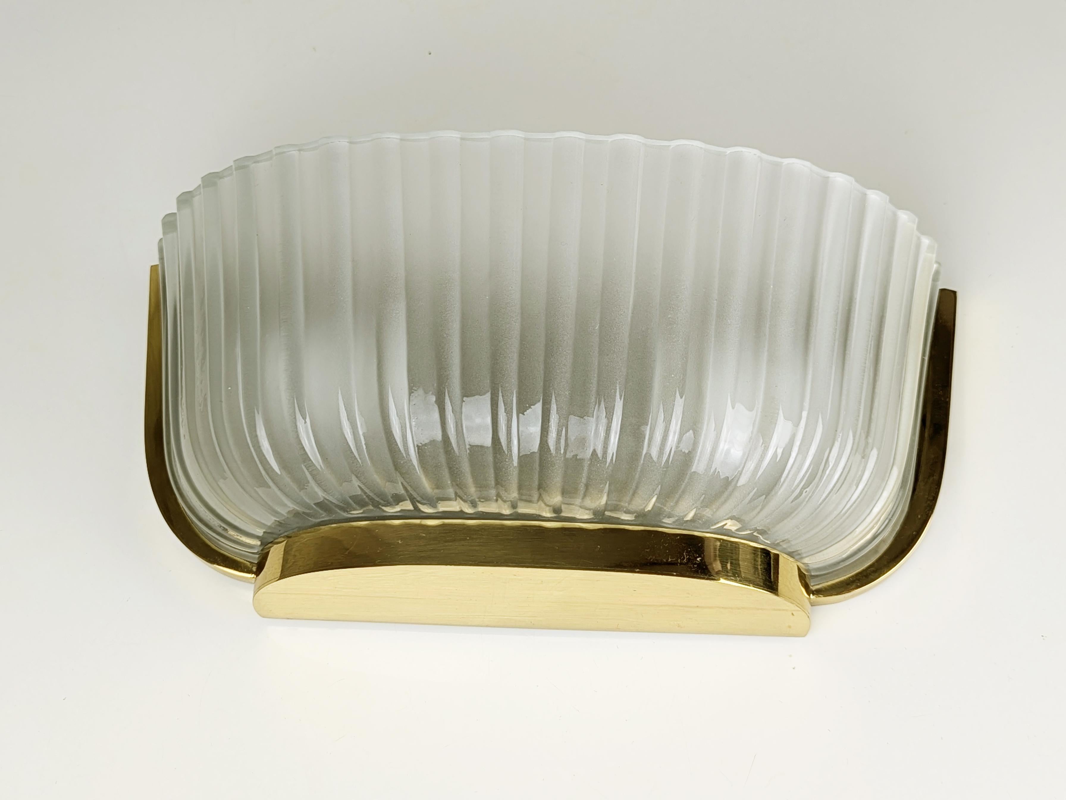 Vintage italian sconce made fro brass and molded/sandblasted glass shade. Lamp features 2 ceramic bulb holders (E27 socket) and remains in very good condition: one small chipping on the inside, not visible once mounted.