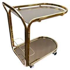 Carrito italiano de mediados de siglo para bebidas, de latón, con cristal espejado color champán