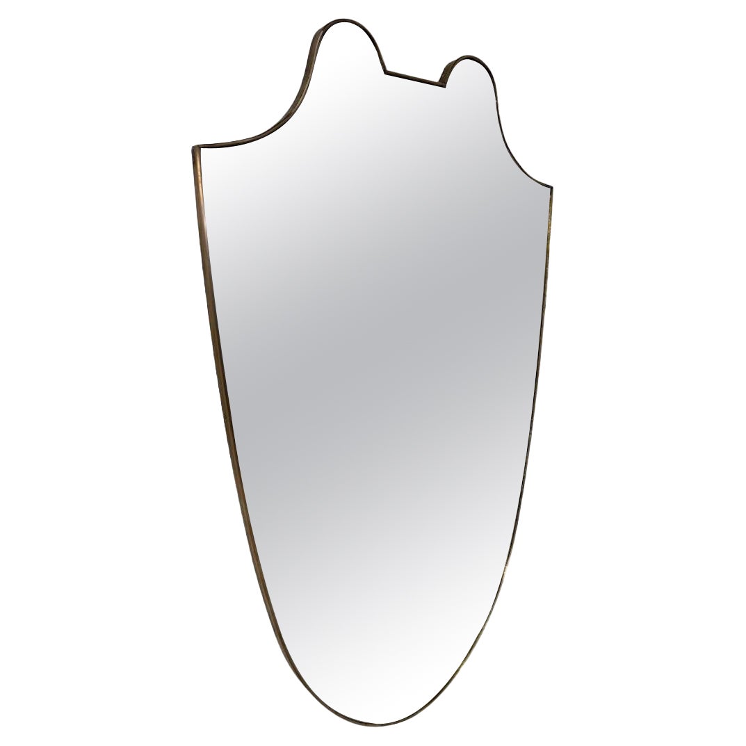 Specchio da parete a forma di scudo con cornice d'ottone, anni '50