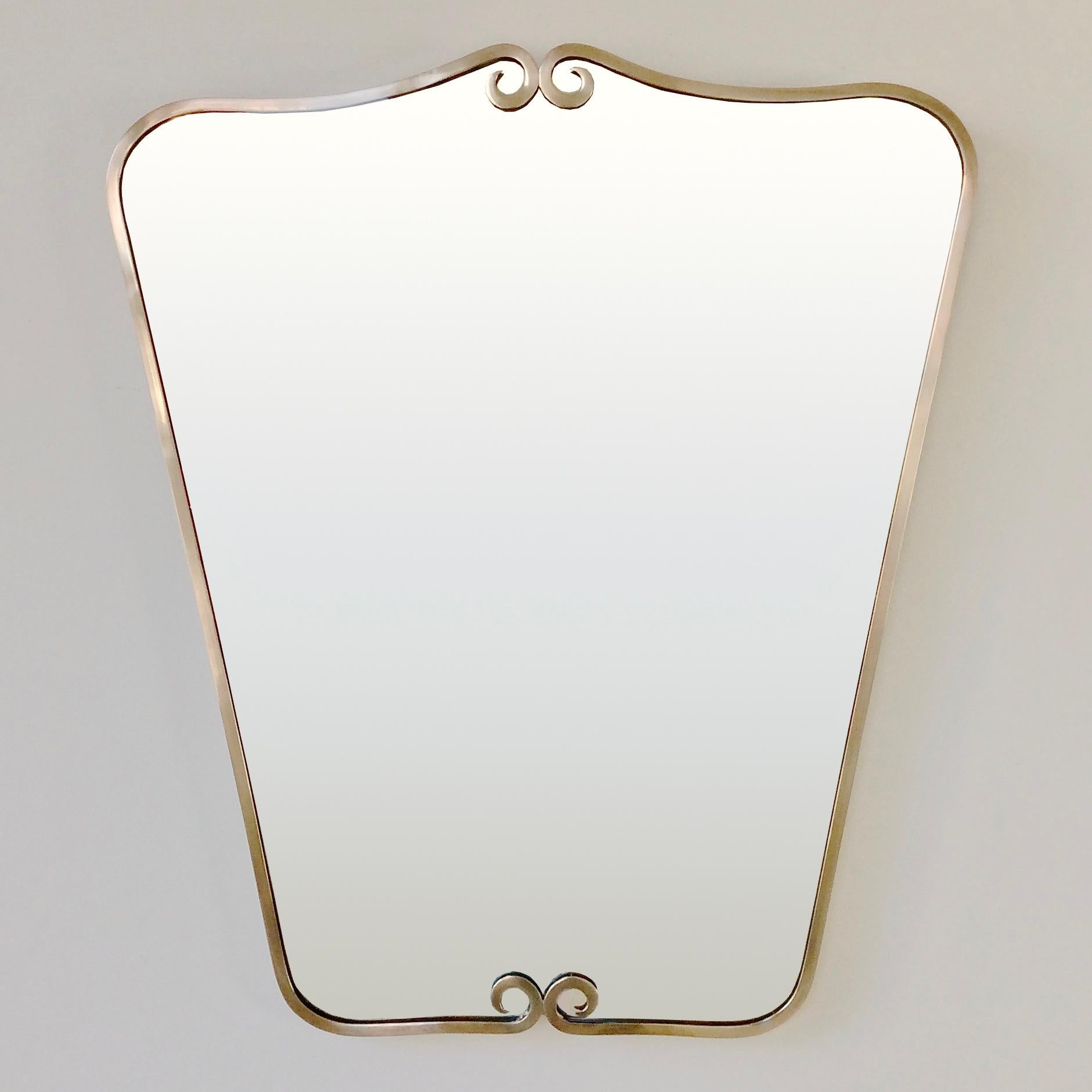 Elegant mid-century wall mirror, circa 1950, Italy.
Polished brass edging, original mirror.
Rare model.
Dimensions: 78 cm H, 67 cm W, 3 cm D.
All purchases are covered by our Buyer Protection Guarantee.
This item can be returned within 14 days