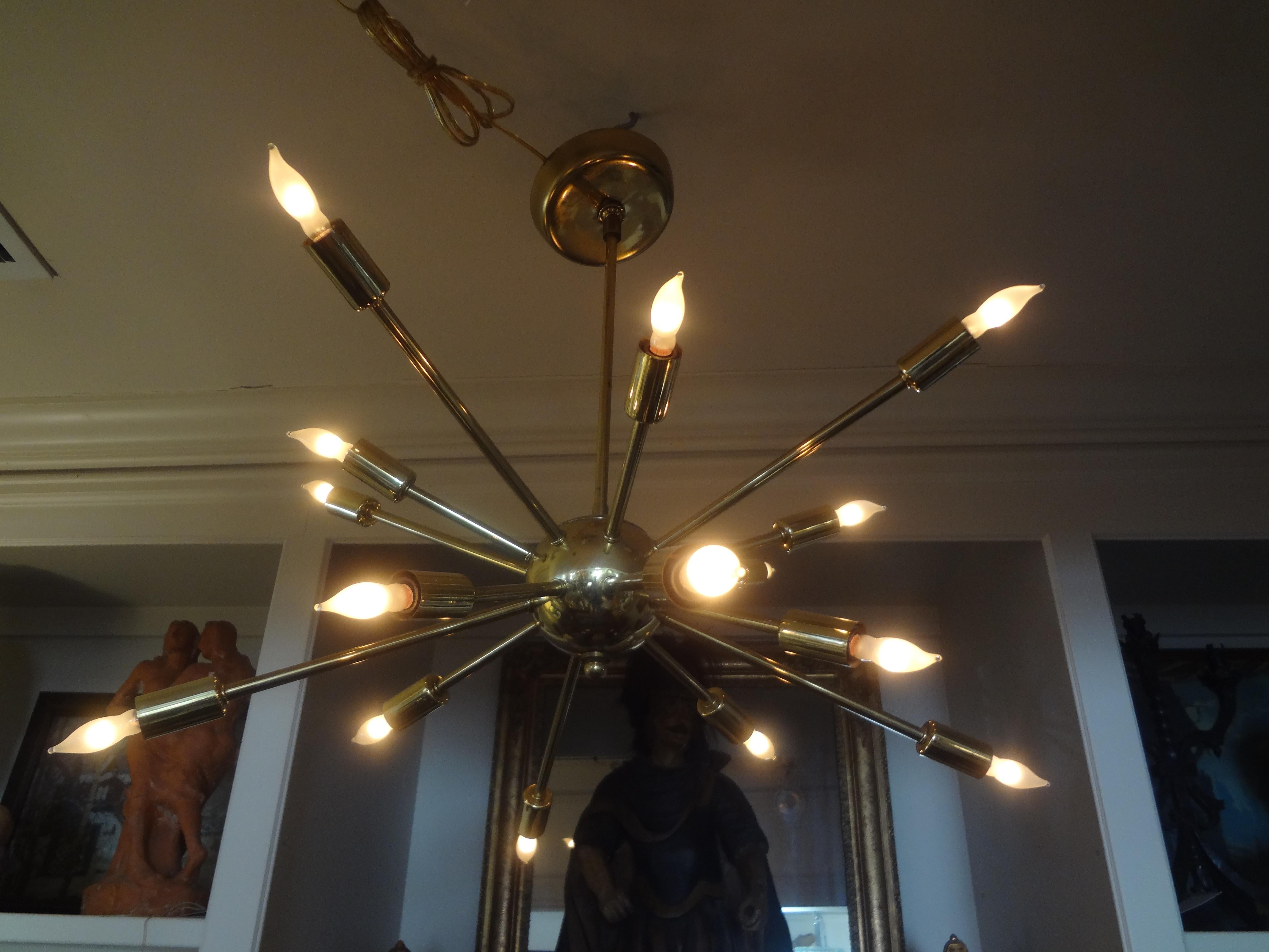 Italian midcentury brass sputnik chandelier. Our 16 arm Italian polished brass sputnik chandelier has been newly wired to U.S. Standards with American sockets and extra lead wire and retains the original canopy.