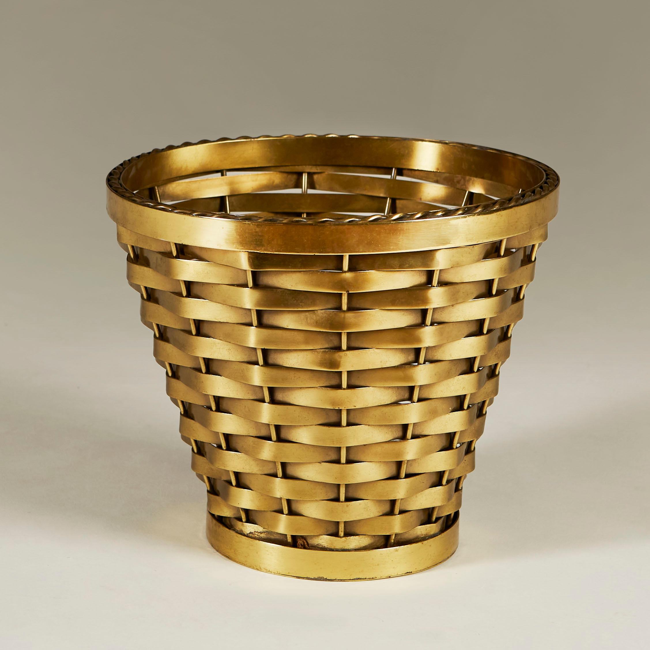 Chic tapered waste paper bin with woven brass lattice design edged with brass rope rim.
  