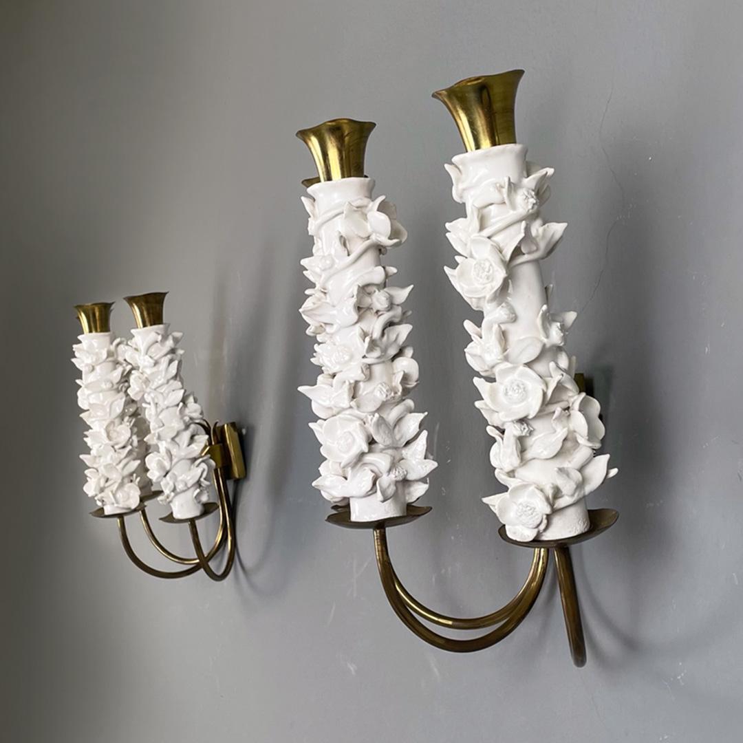 Italian mid-century ceramic flower and brass arms applique by Luigi Zortea, 1949
Set of three brass and ceramic wall lights with three lights. The structure has 3 brass rod arms and 3 brass diffusers with white ceramic floral decoration.
Produced in