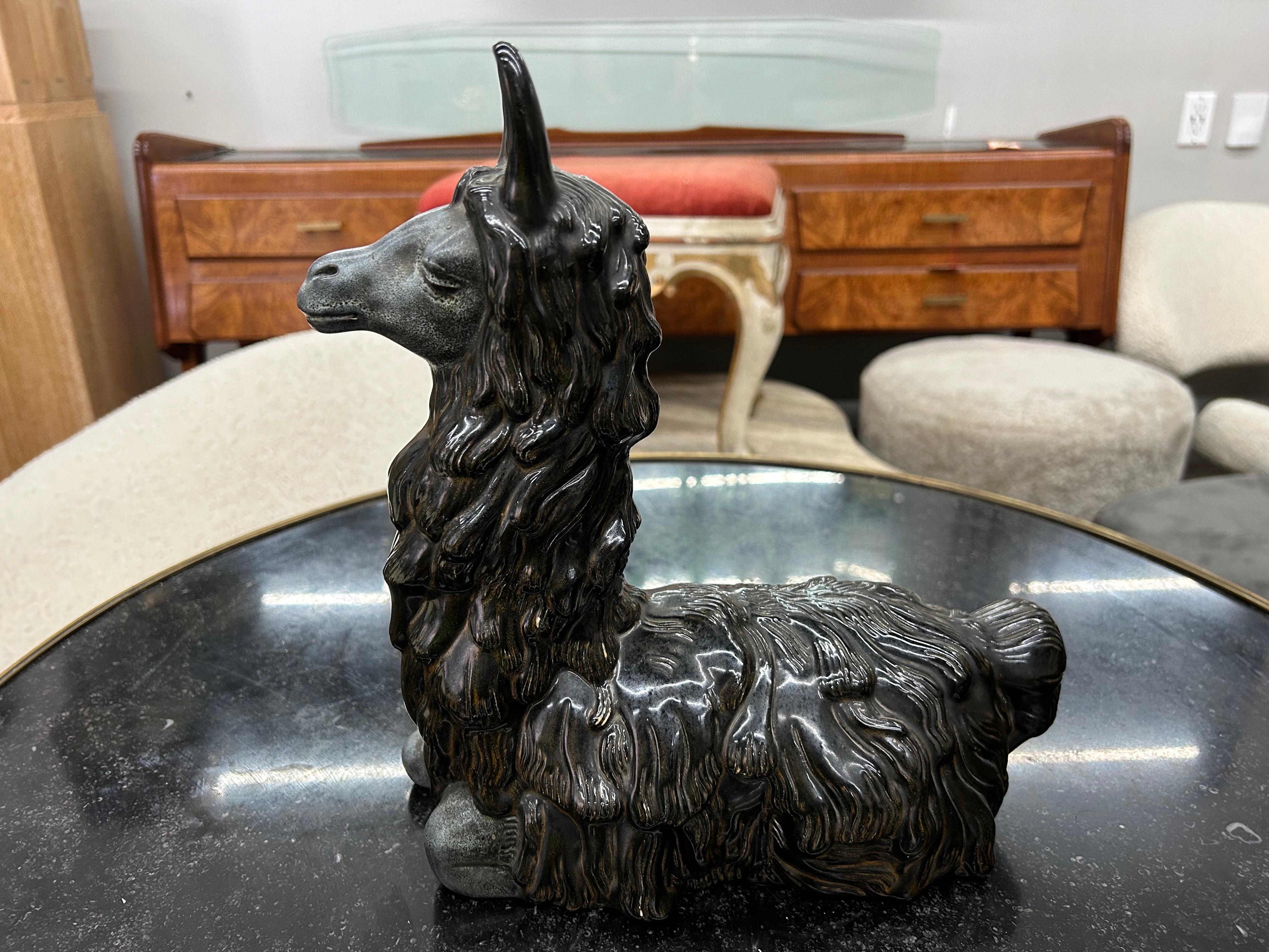 Italian Mid Century Ceramic Llama.
This whimsical Italian mid century ceramic llama sculpture or figure was expertly created with attention to detail and fully marked with the makers stamp.
Great coffee table or bookcase accessory!