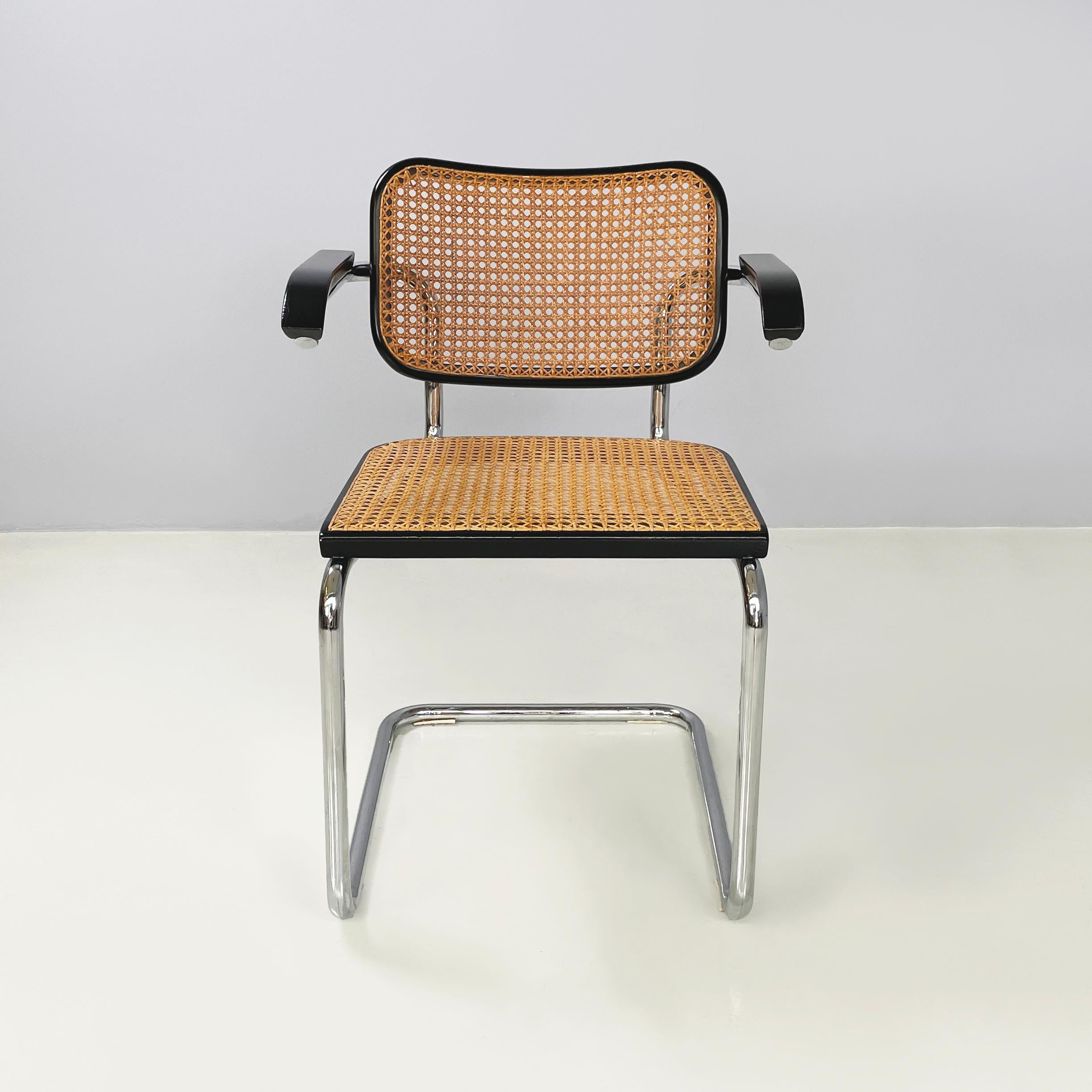 Italian mid-century modern Chair with armrests Cesca by Marcel Breuer for Gavina, 1960s
Iconic and vintage chair with armrests mod. Cesca with seat and backrest in Vienna dark straw and black painted wooden profiles. The structure is in tubular