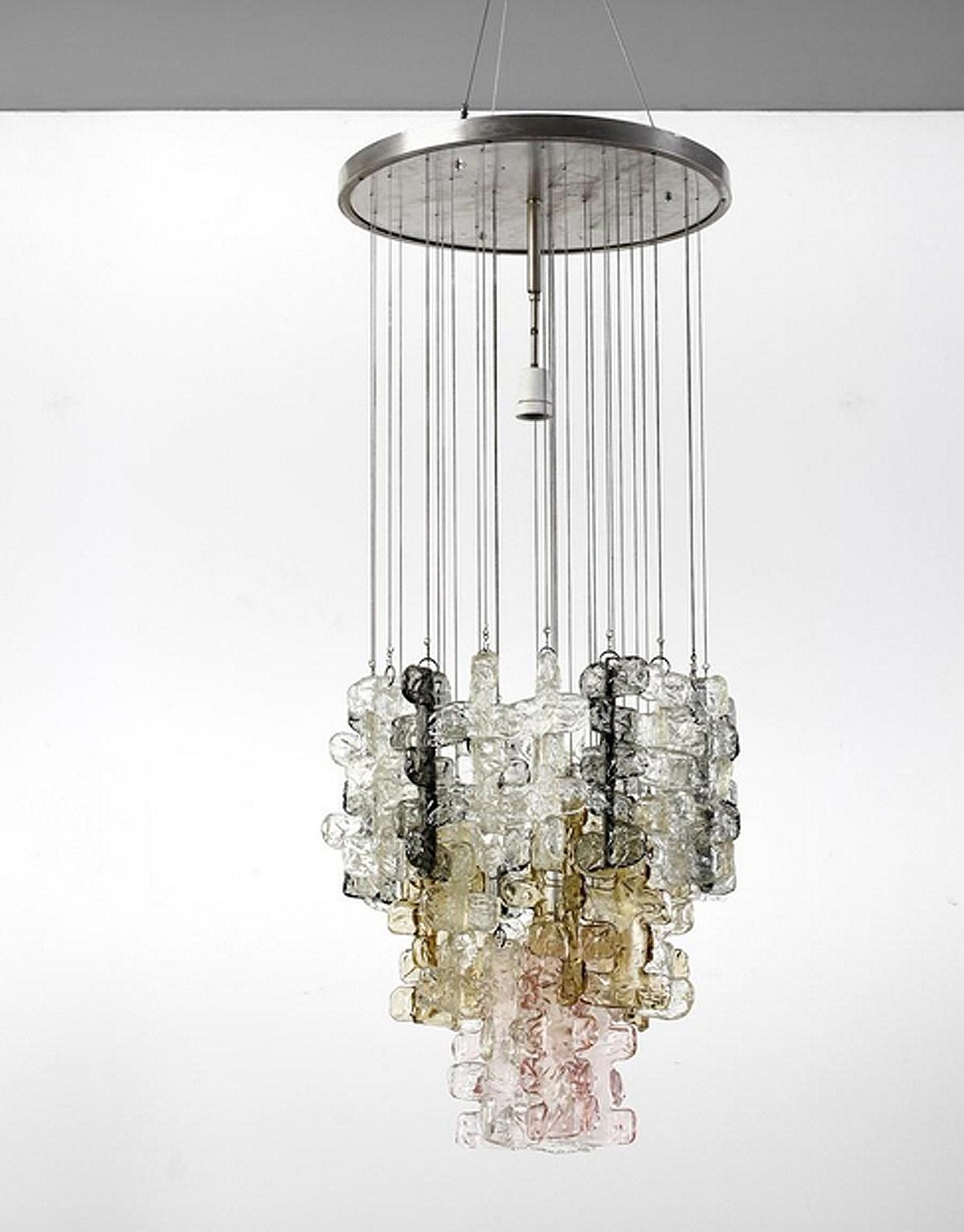 Rare chandelier with 32 pieces of curly transparent Murano hand-crafted ice glasses hanging from a chromed ceiling plate down on chromed chains of different lengths. All glasses are in mint condition, with no repairs or chips. Every single glass