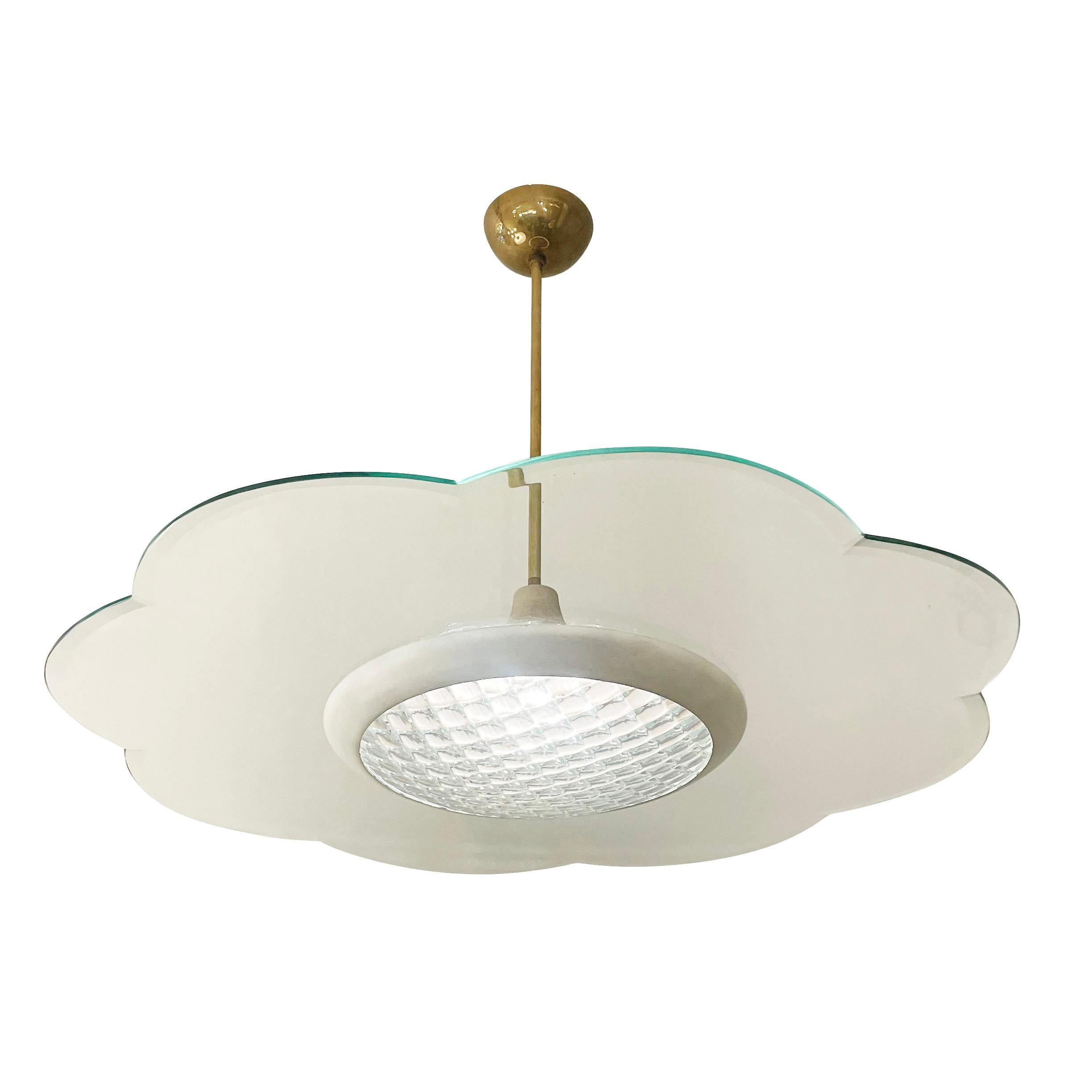 Italian Midcentury chandelier with scalloped glass.
$3,500.00
Italian midcentury chandelier with a large flat glass with scalloped edges and a central curved glass with a square pattern. Framing is brass and white. Holds one E26 socket. Height can