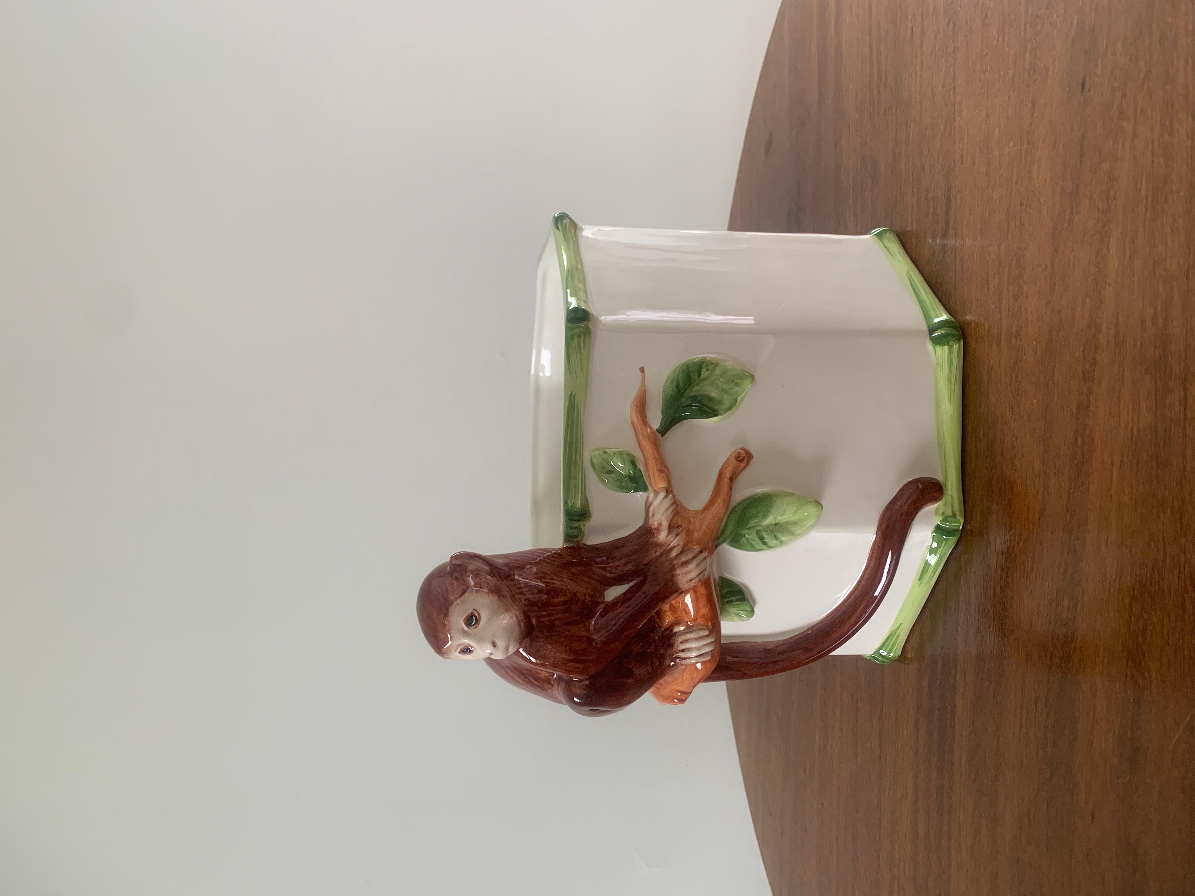 An outstanding Mid-Century Chinoiserie porcelain cachepot planter with a monkey and bamboo

Italy, Mid-20th Century 

Hand painted porcelain

Measures: 11