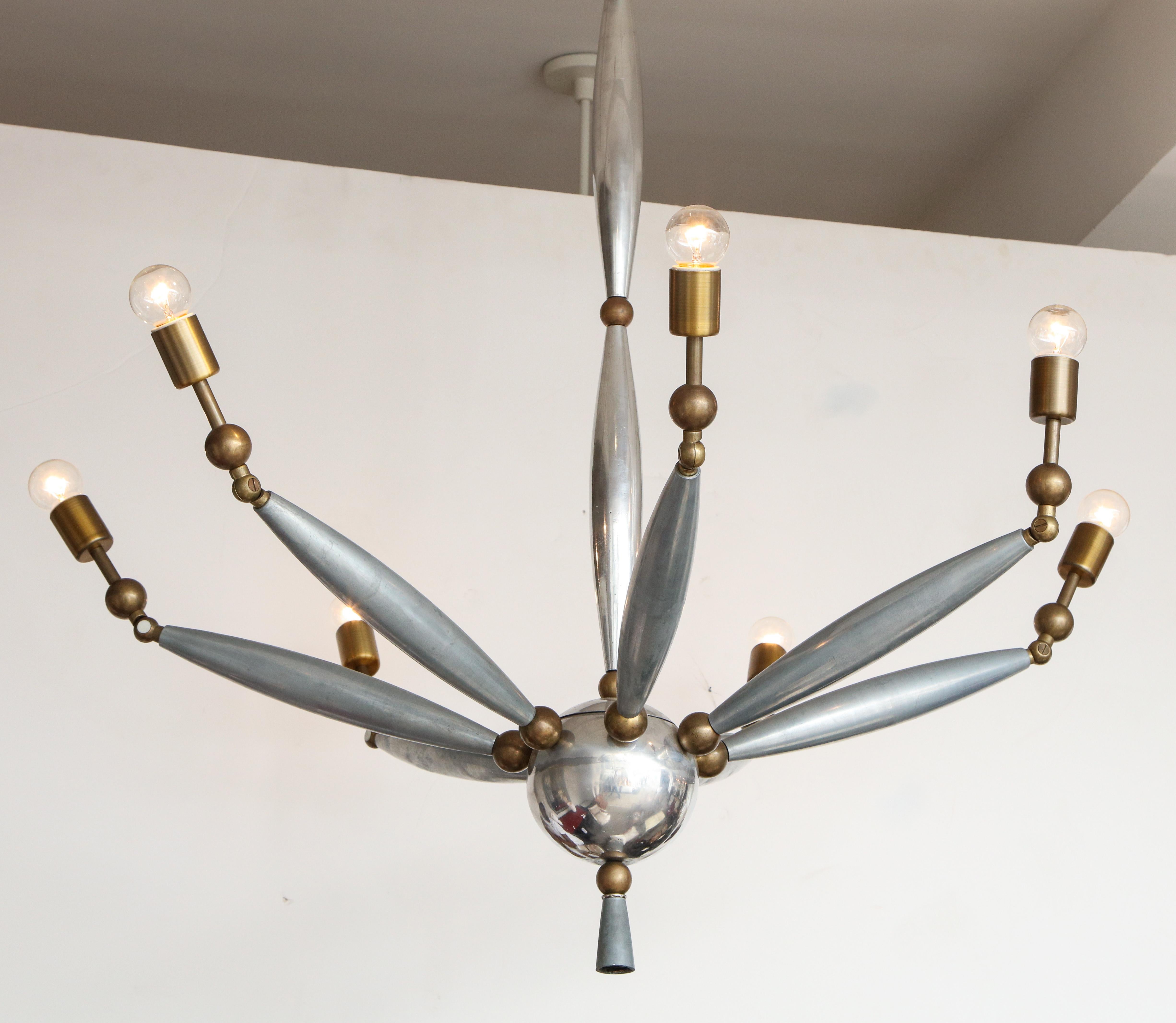 Italian midcentury chrome and brass chandelier with articulating arms.