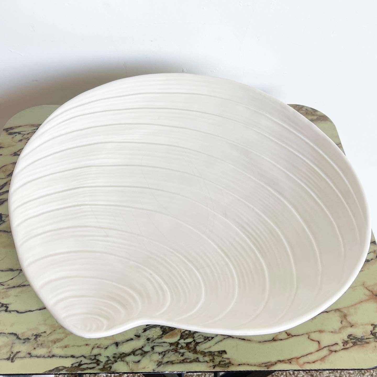 Discover the charm of this wonderful vintage mid-century Italian hand-made platter. Crafted with care, this exquisite piece showcases a glossy off-white finish throughout its surfaces, exuding a timeless elegance and serving as a versatile and