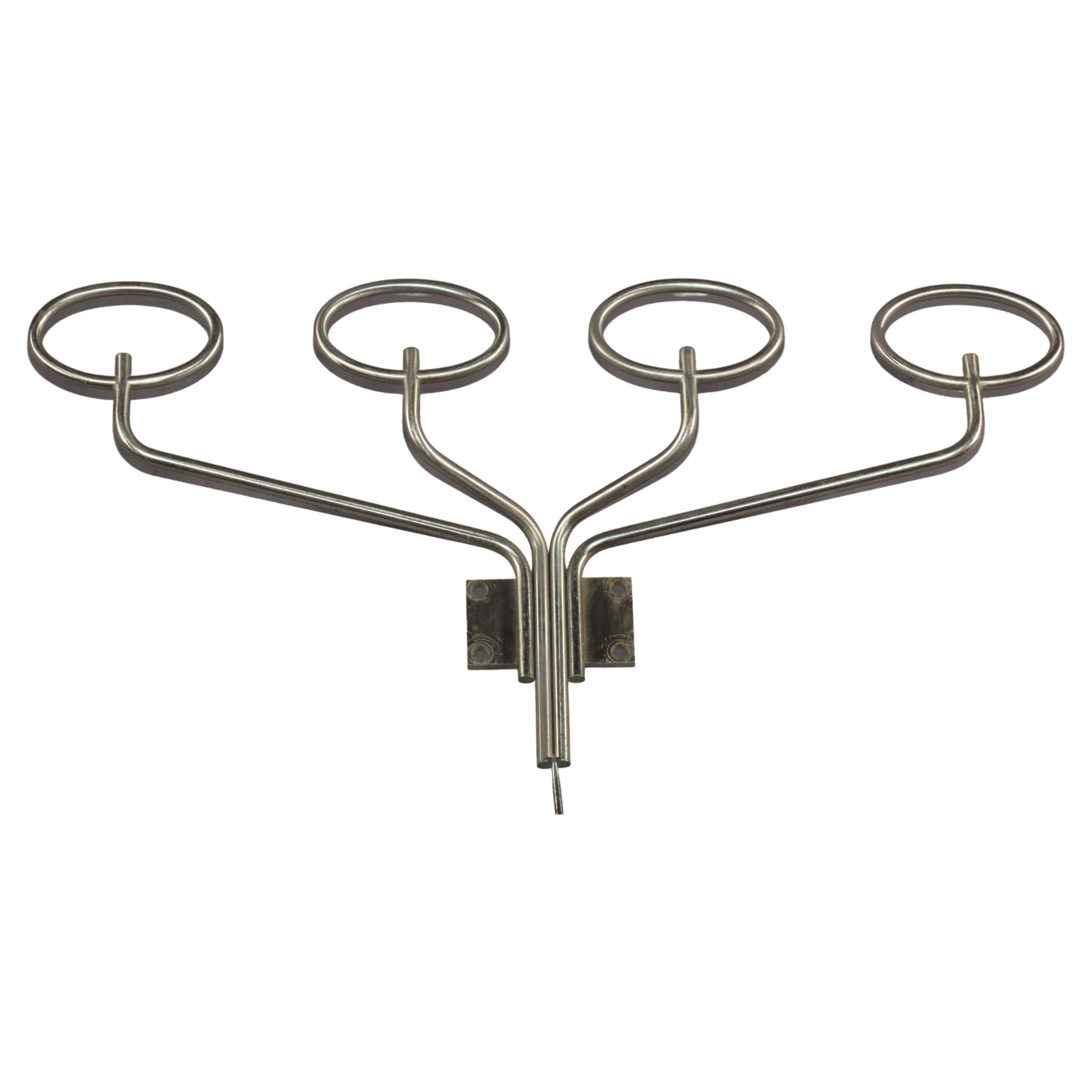Italian mid-century Clitoquattro wall coat by Graminia and Mazza for Artemide, 1960s
Clitoquattro wall coat hooks composed of four oval-shaped hooks. The structure is in tubular nickel.
Produced by Artemide in 1960s and designed by Giuliana