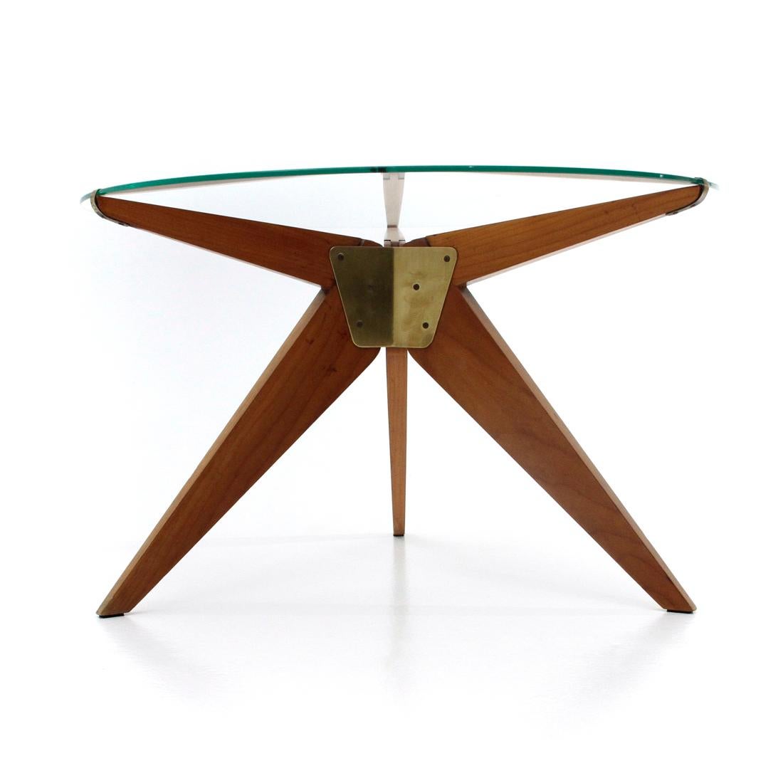 Coffee table produced in the 1950s of Italian manufacture.
Circular glass top.
Wooden legs with brass plate.
Good general conditions, some signs due to normal use over time.

Dimensions: Diameter 70 cm, height 43 cm.