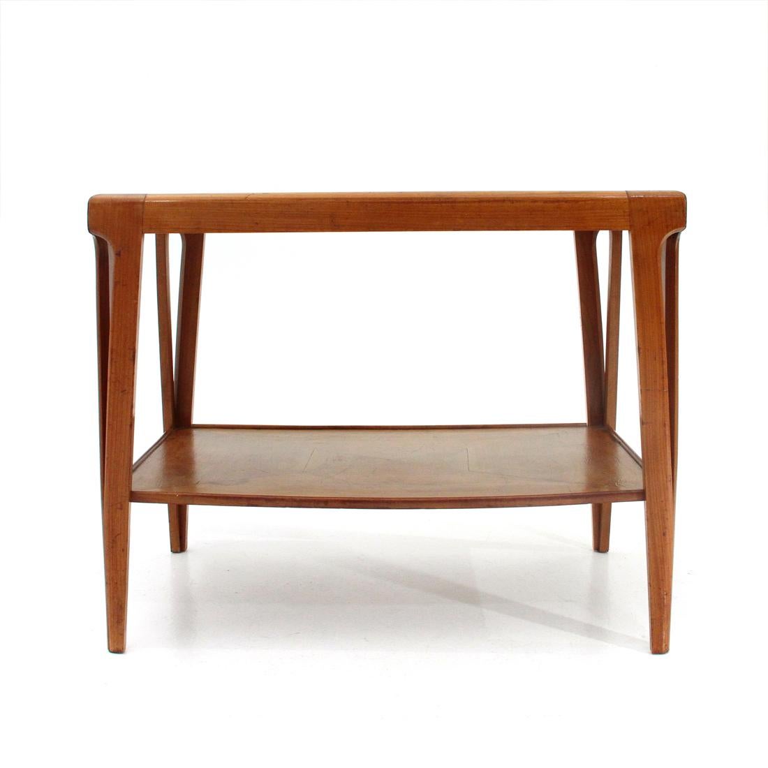 Italian-made coffee table produced in the 1950s.
Legs and frames of solid wood tops.
Veneered wood tops.
Structure in good condition, some marks and halos due to normal use over time.
A foot restored with a screw, irregular angles due to the