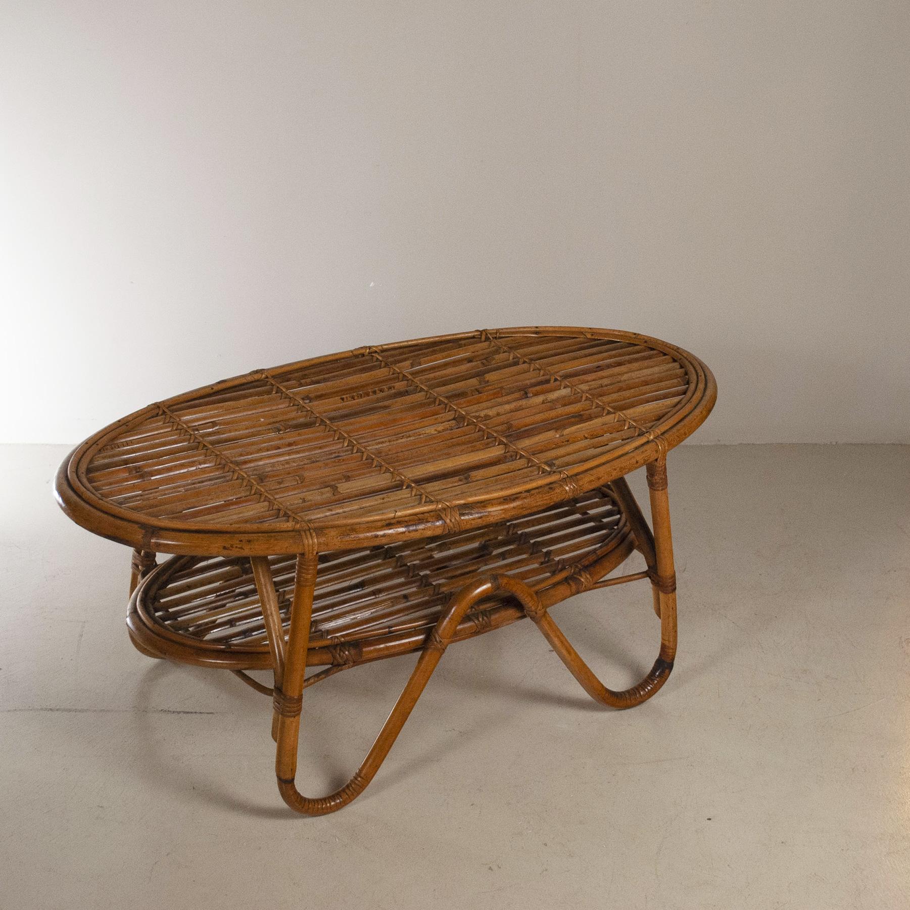 Coffee table in bamboo cane with an oval shape with double support surface, Italian production from the mid-1960s.