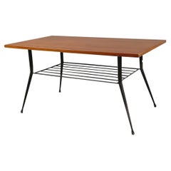 Italian mid-century Coffee table with magazine rack in wood and metal, 1960s