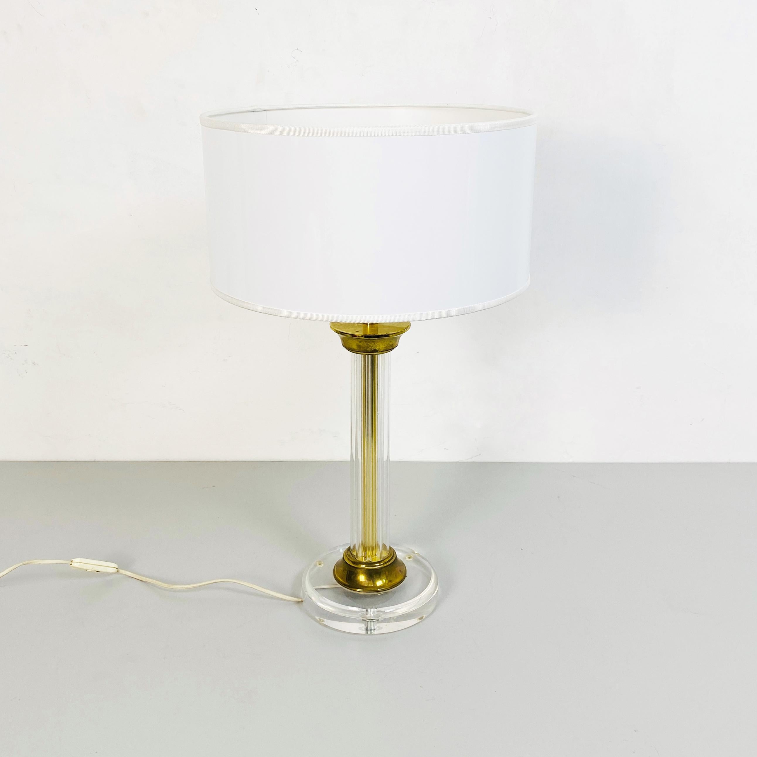 Italian mid-century column-shaped plexiglass and brass table lamp, 1970s
Column-shaped table lamp in transparent plexiglass with brass details, new glossy white lampshade.
1970s
Good conditions.
Measure in cm 36 x 60 H.