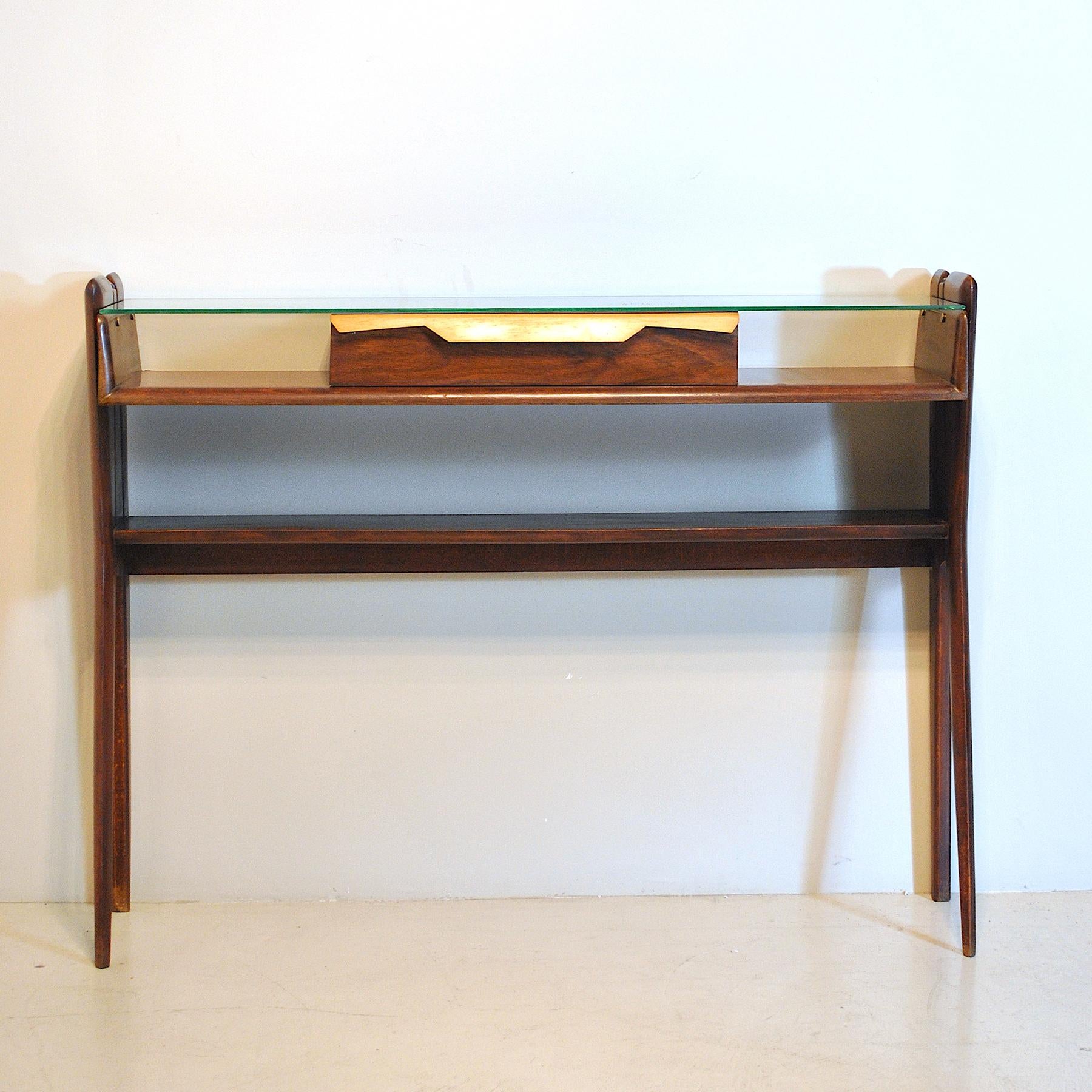 Sculptural console table in dark walnut, narrow with single drawer and glass top, Italian 1950's by Mobili Pennati Egidio in the style of Ico Parisi.