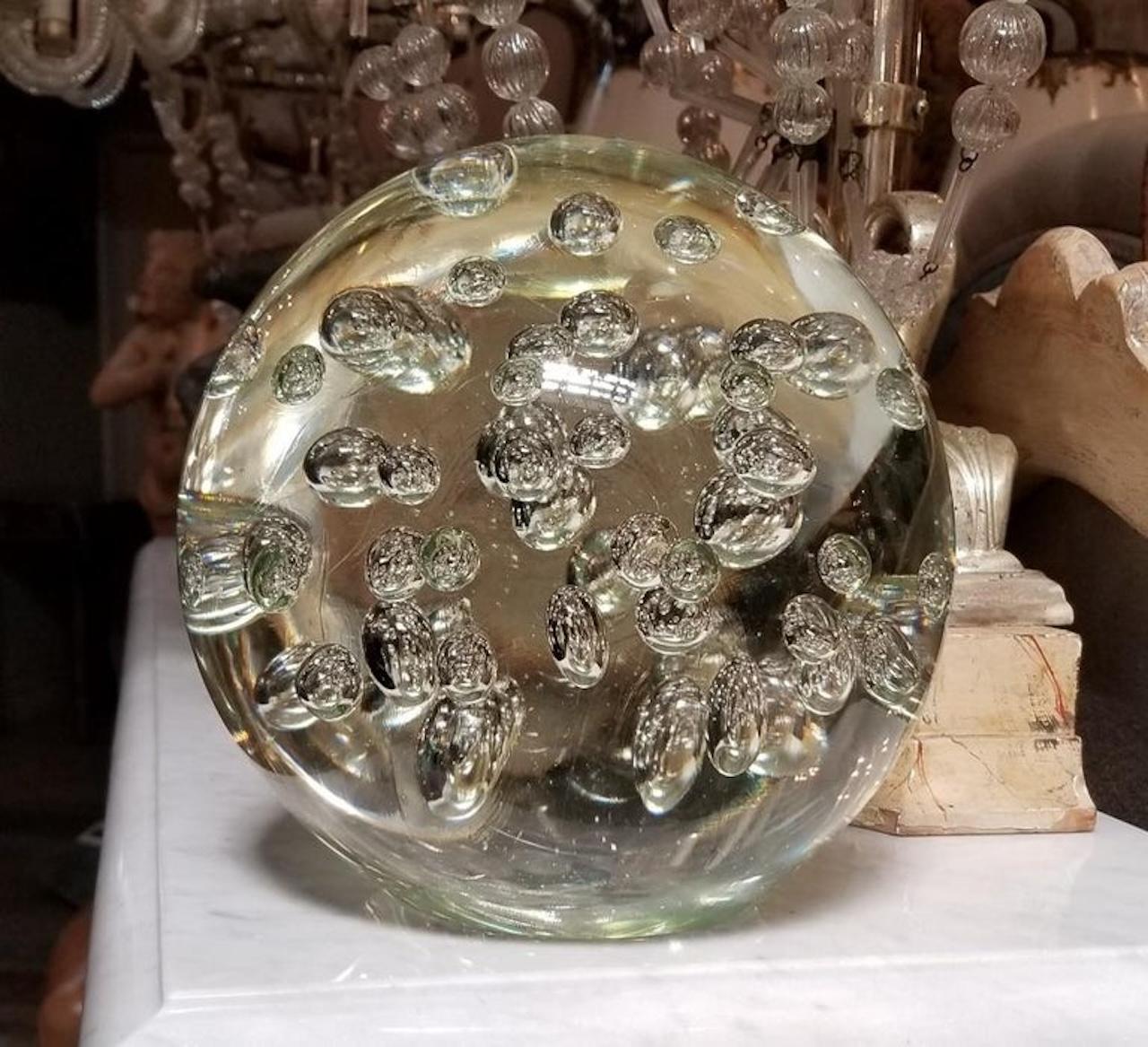 Italian Mid-Century crystal sphere with air bubbles throughout. Flat on bottom to sit on surfaces.