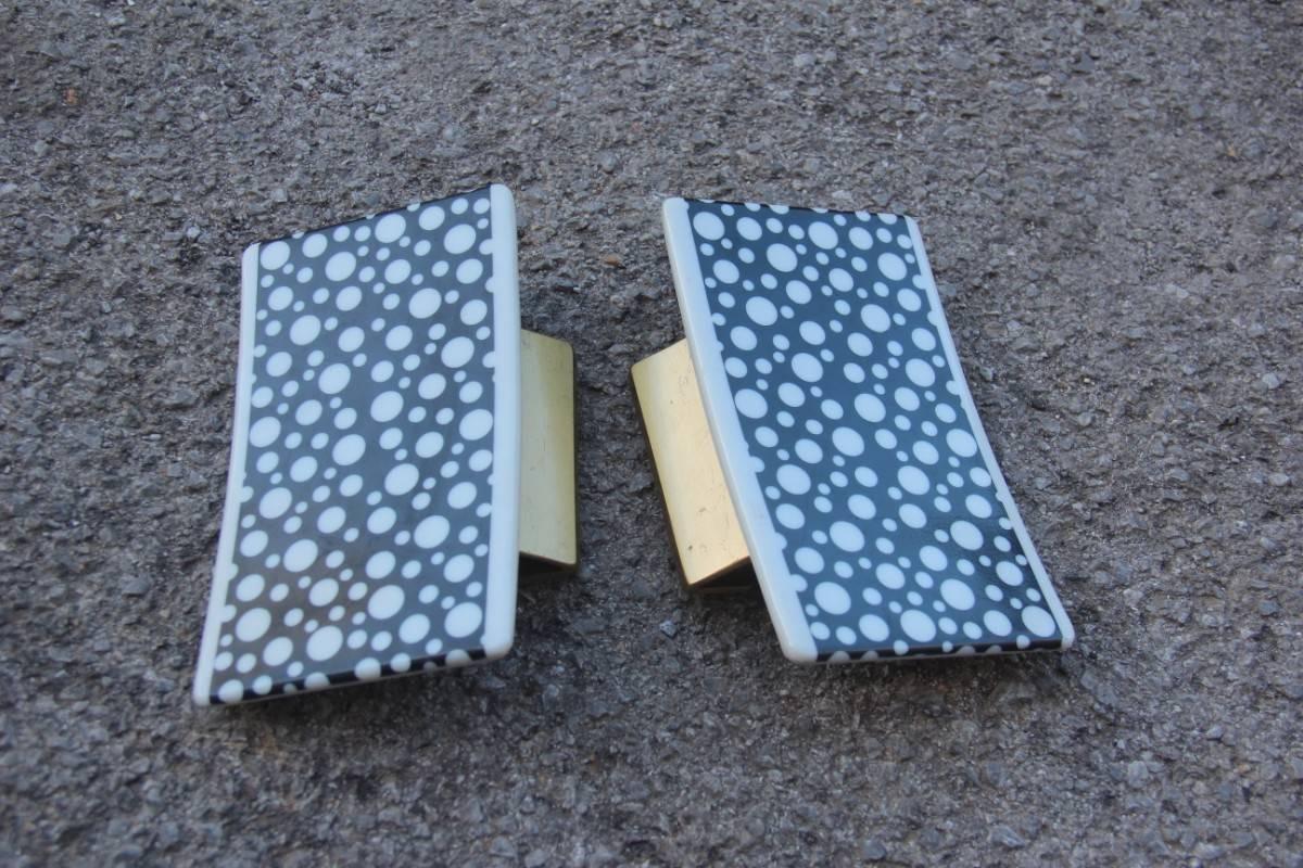 Italian midcentury design handles very particular form, brass and polycarbonate.