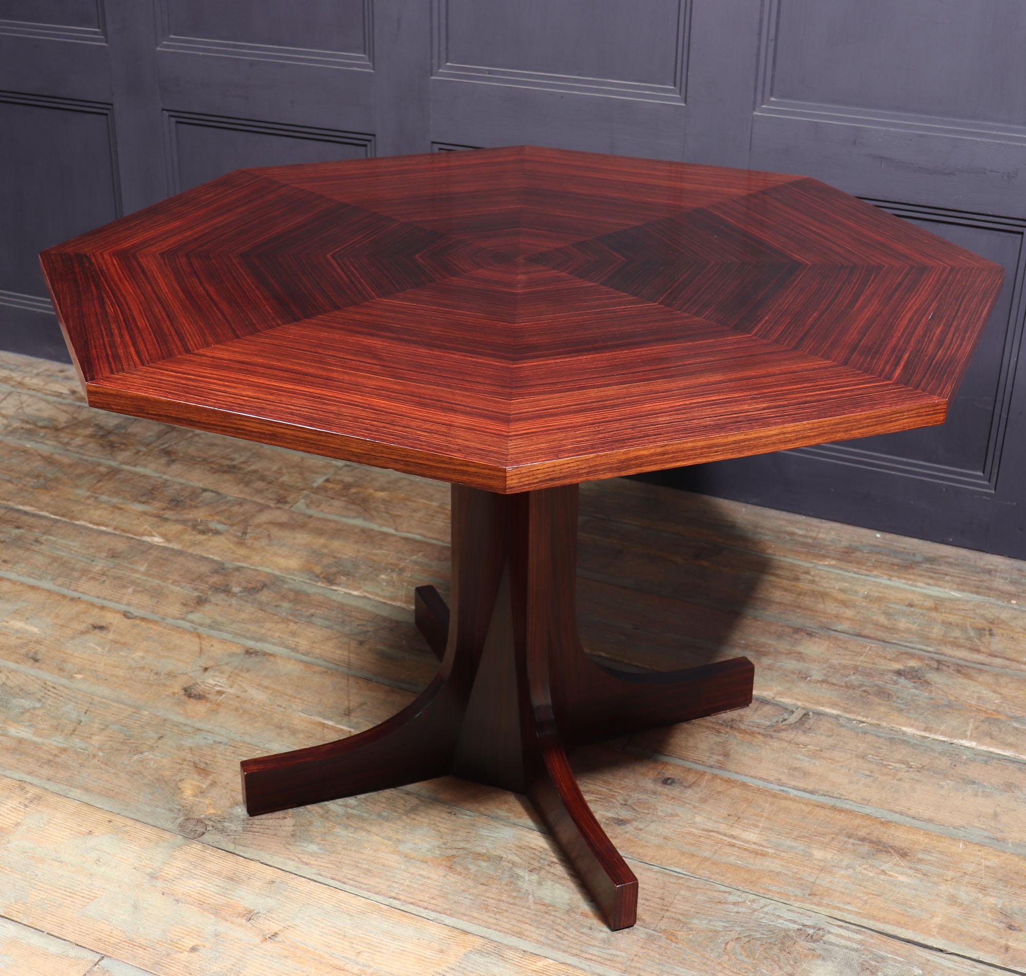 Italian midcentury dining table.
A midcentury dining table of octagonal form, having a stunning segmented top and standing on a central column with four feet
Age: circa 1960

Style: Italian midcentury

Origin : Italy

Material: