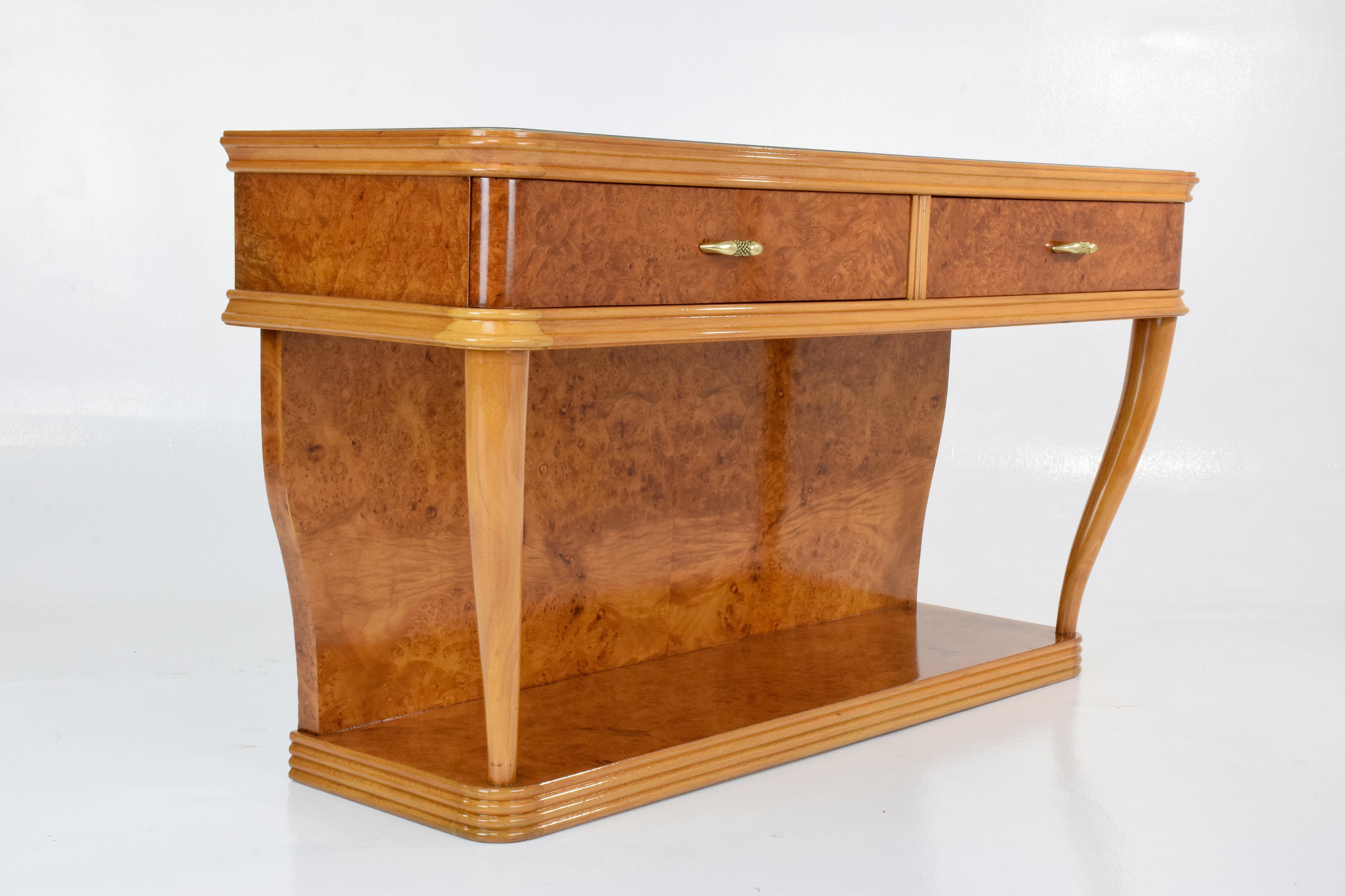 Mid-Century Italian art deco style dresser or vanity composed of bird's-eye maple veneer, beechwood frame, a glass tabletop with a sheath of colored paper underneath and a detachable vintage mirror. The console has two drawers with solid brass