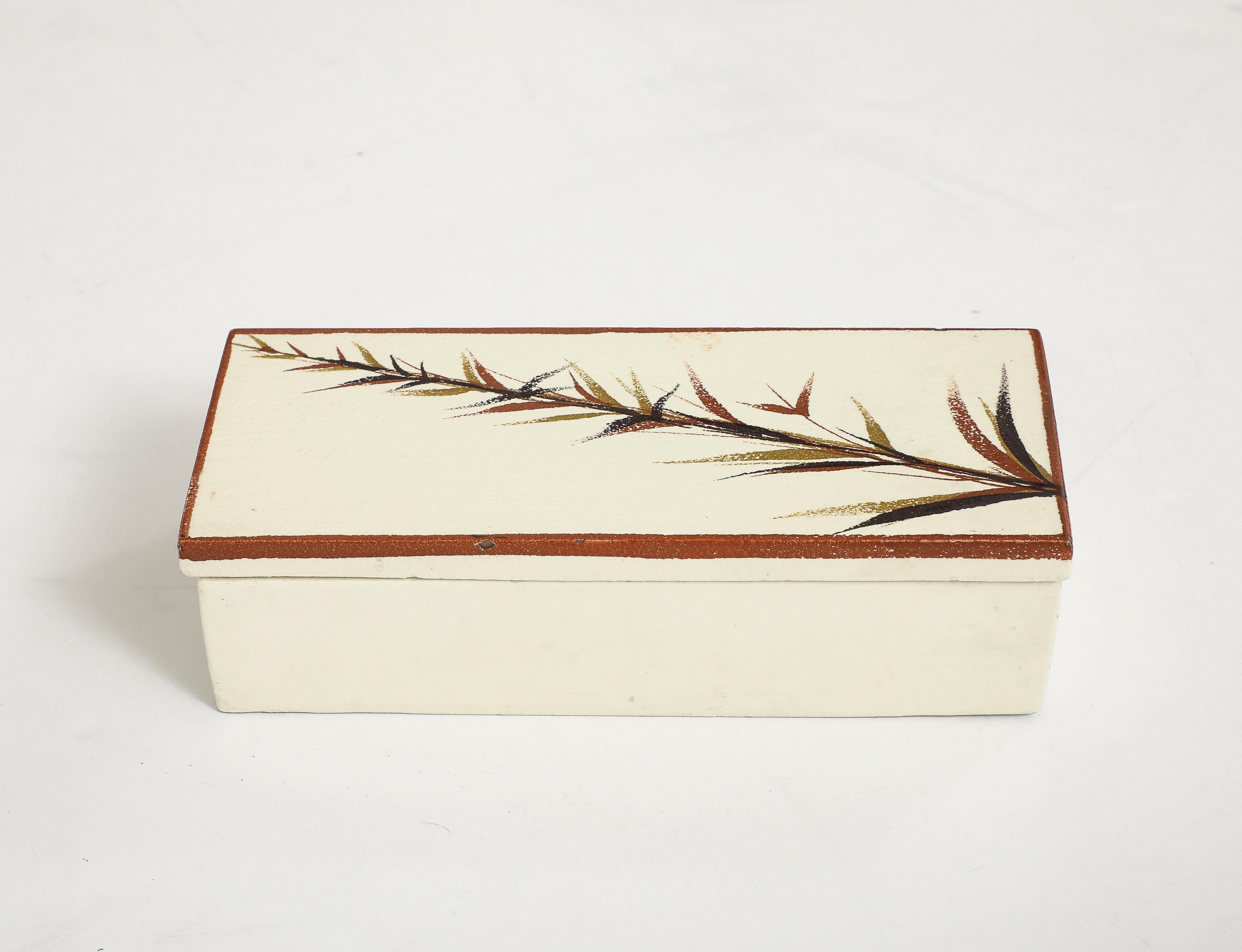 Mid Century Italian bone white glazed ceramic cigarette box with a hand decorated lid featuring a stylized fern.
