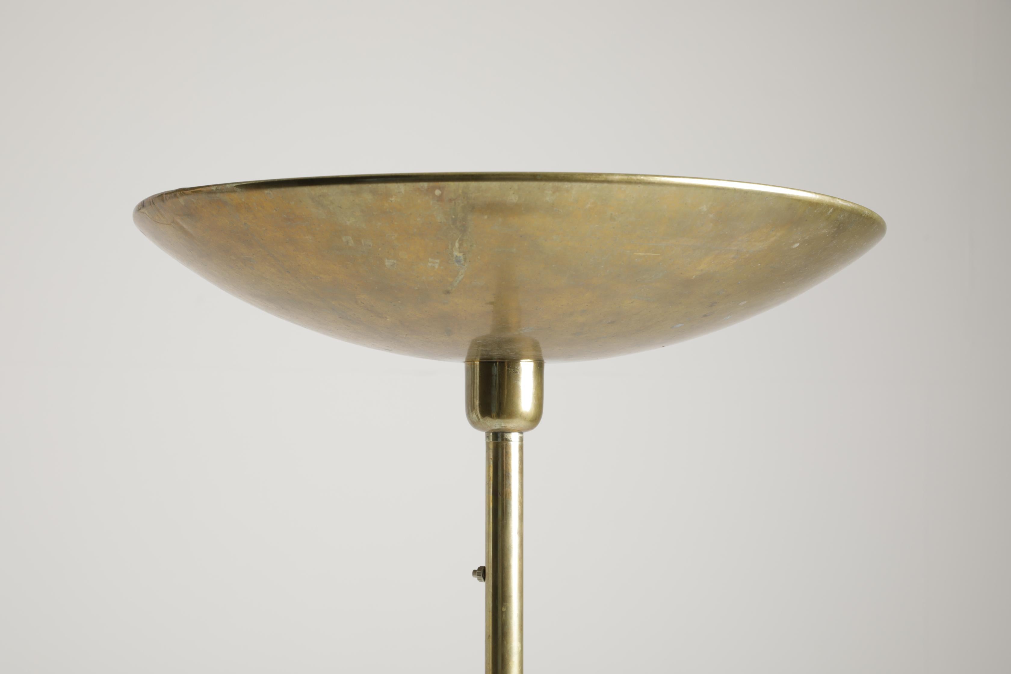 Monumental brass floor lamp, made in Italy in the 1940s, retains a beautiful original patina and gives the environment a remarkable scenographic impact. 
There are three light points.
 