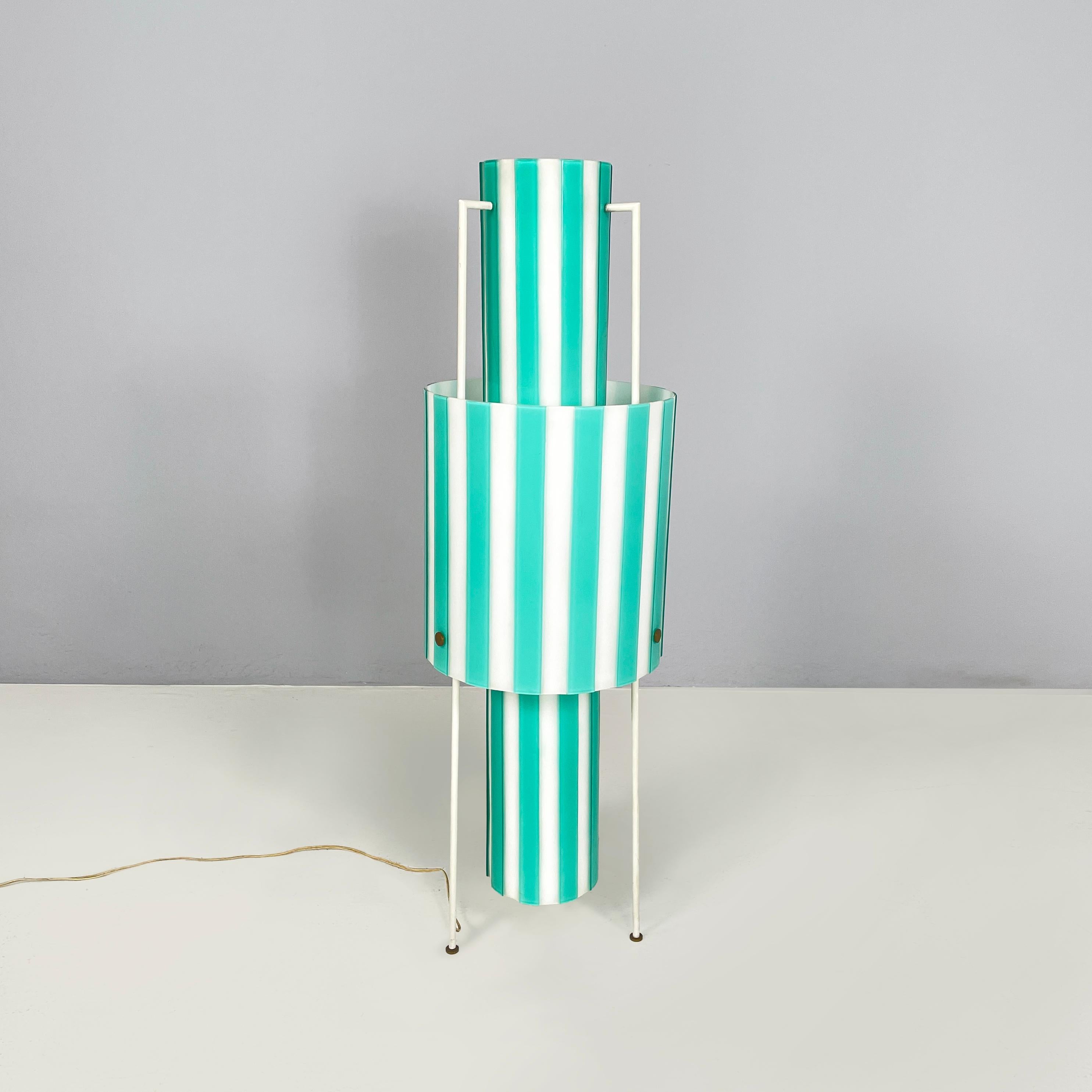 Italian mid-century modern Floor lamp in white and light blue glass with metal, 1950s
Floor lamp in handmade glass in white with tiffany blue raised stripes. The structure is made up of two cylinders, one inside the other: a wider and lower external