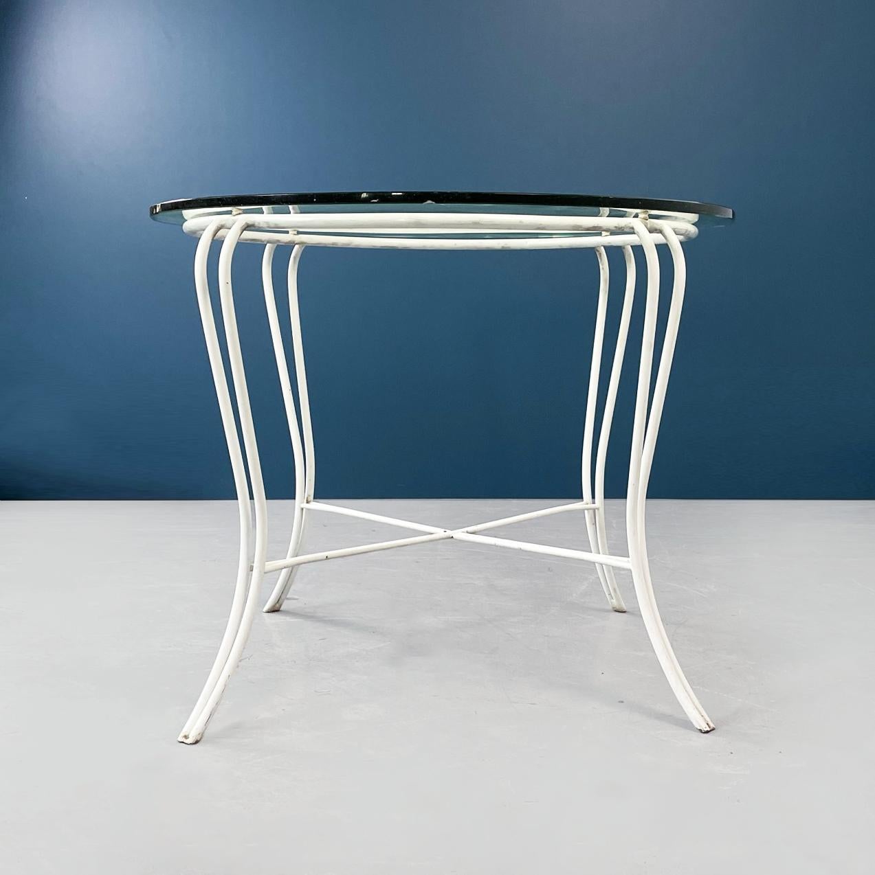 Italian mid-century Garden table in white wrought iron and glass, 1960s
Garden table with white painted wrought iron structure. The legs are finely worked. The round top, in thick glass in aquamarine green, is leaning on the structure.
1960s
Good