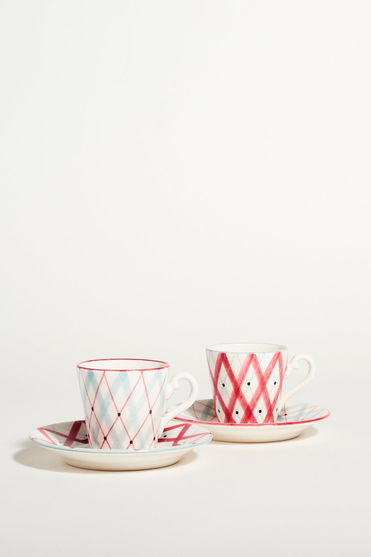 Mid century demitasse set of two in a raspberry pink and pale blue geometric pattern.